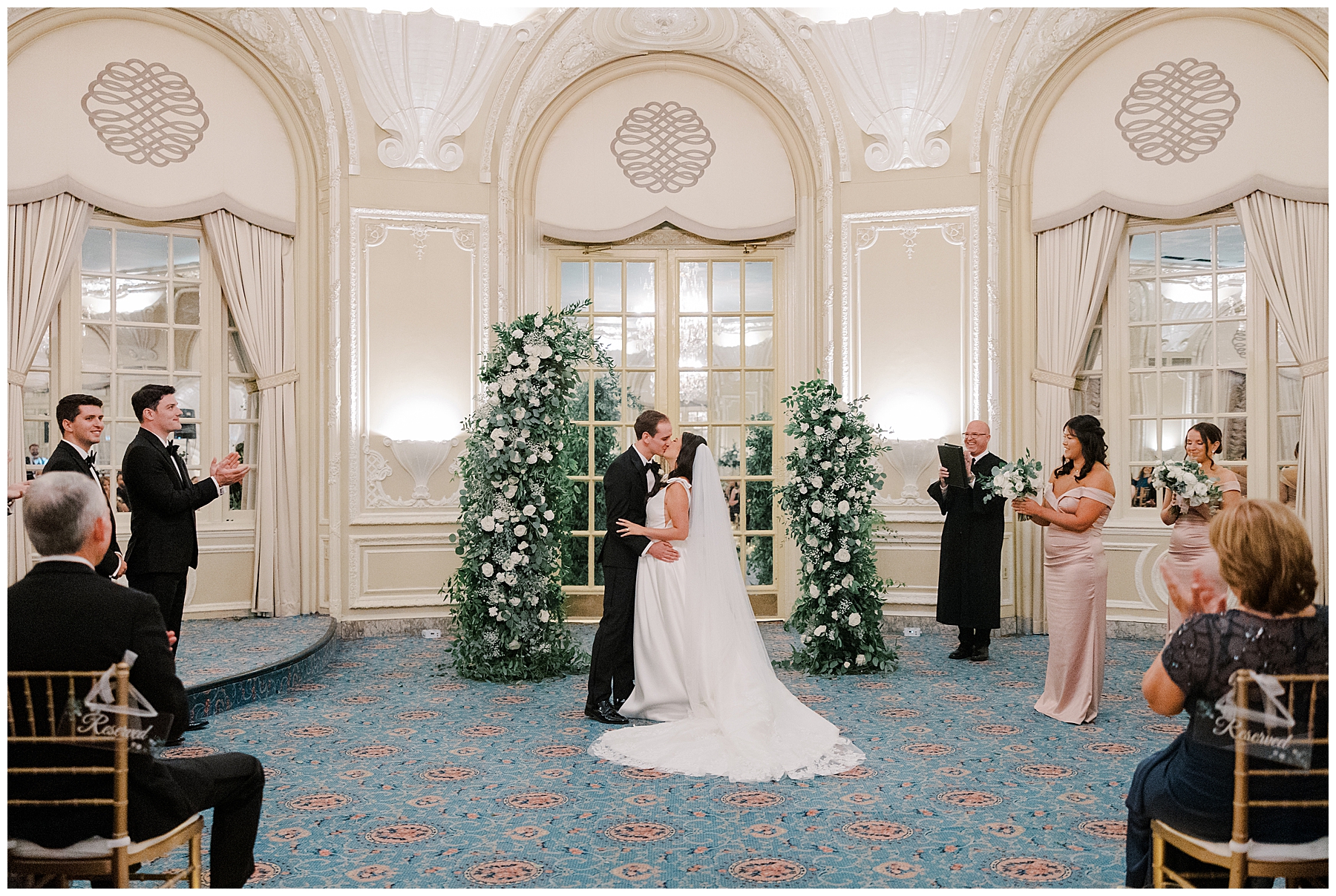 bride and groom kiss during wedding ceremony