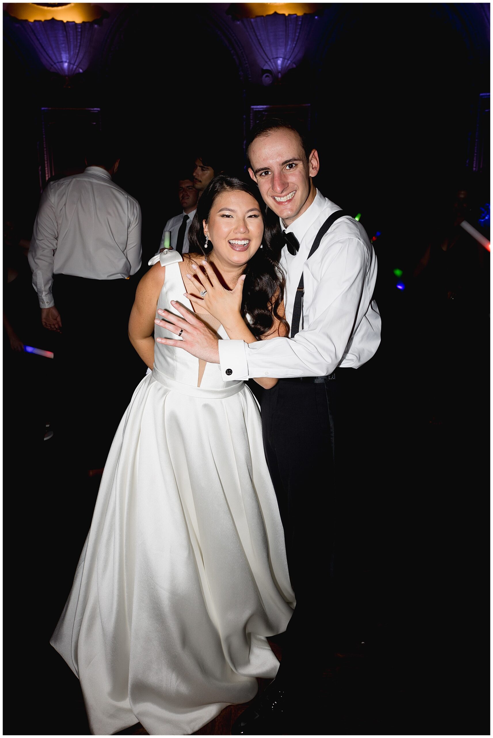 Newlyweds show off wedding rings on dance floor