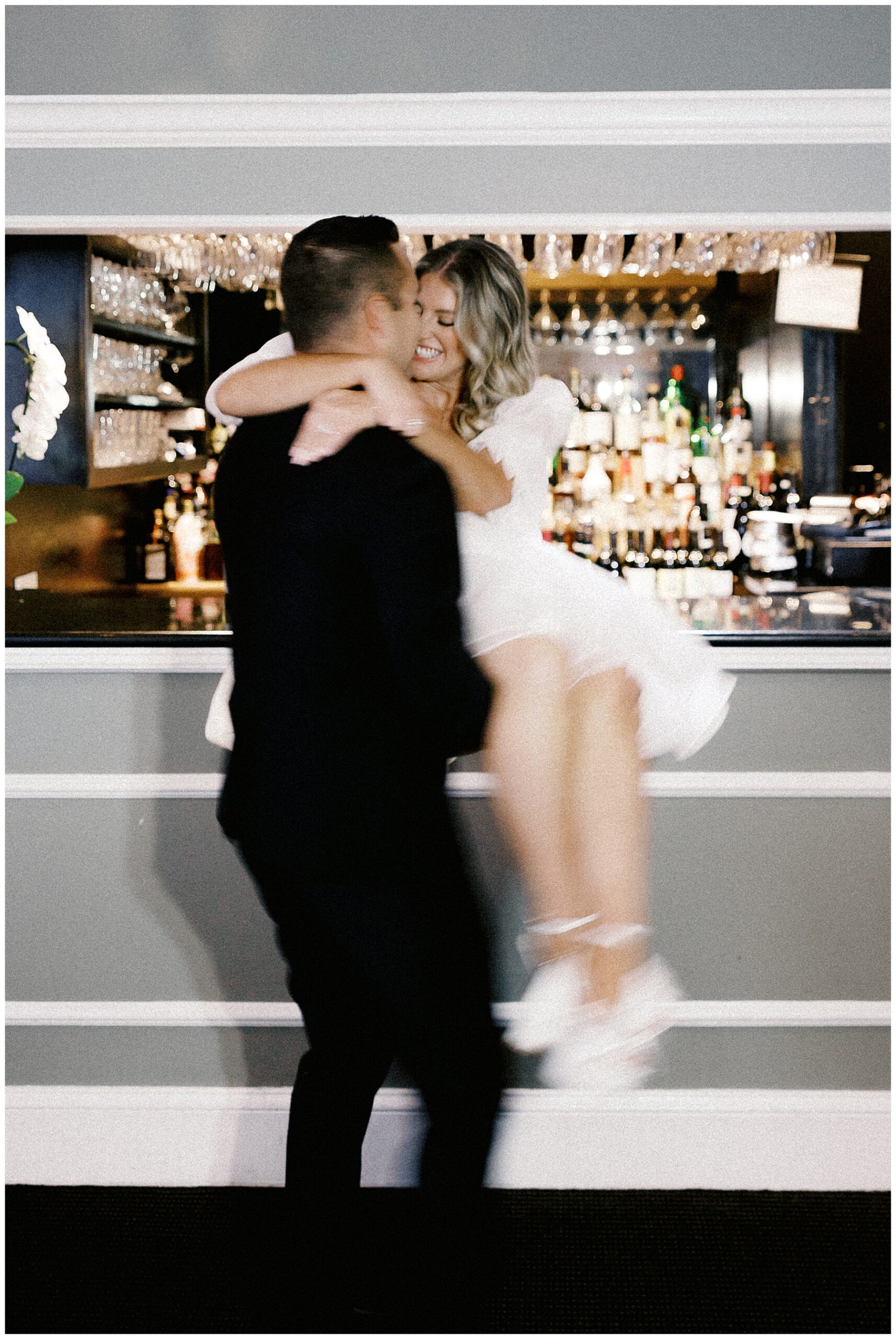 guy lifts fiancé up in arms