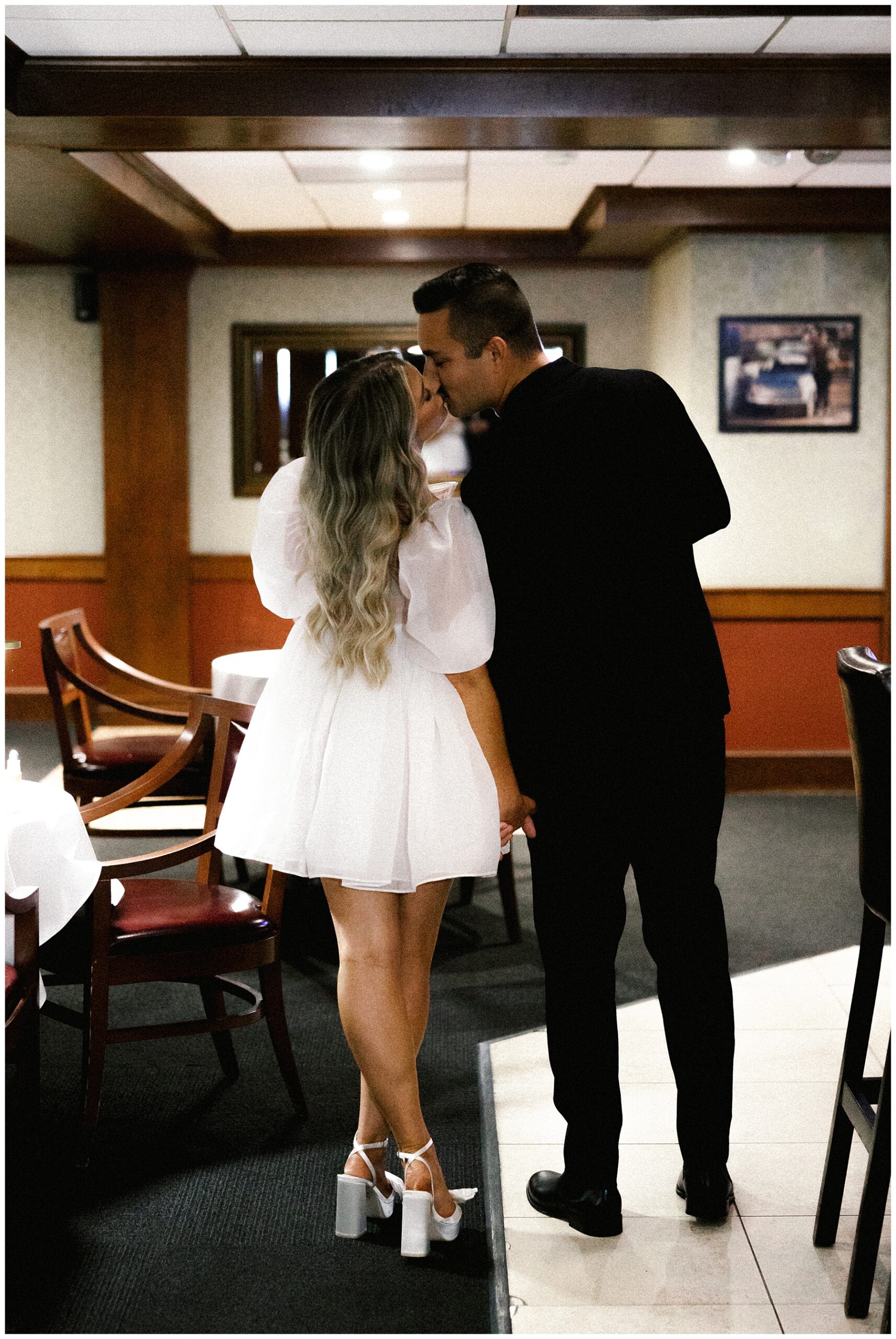 couple kiss at Luciano's restaurant