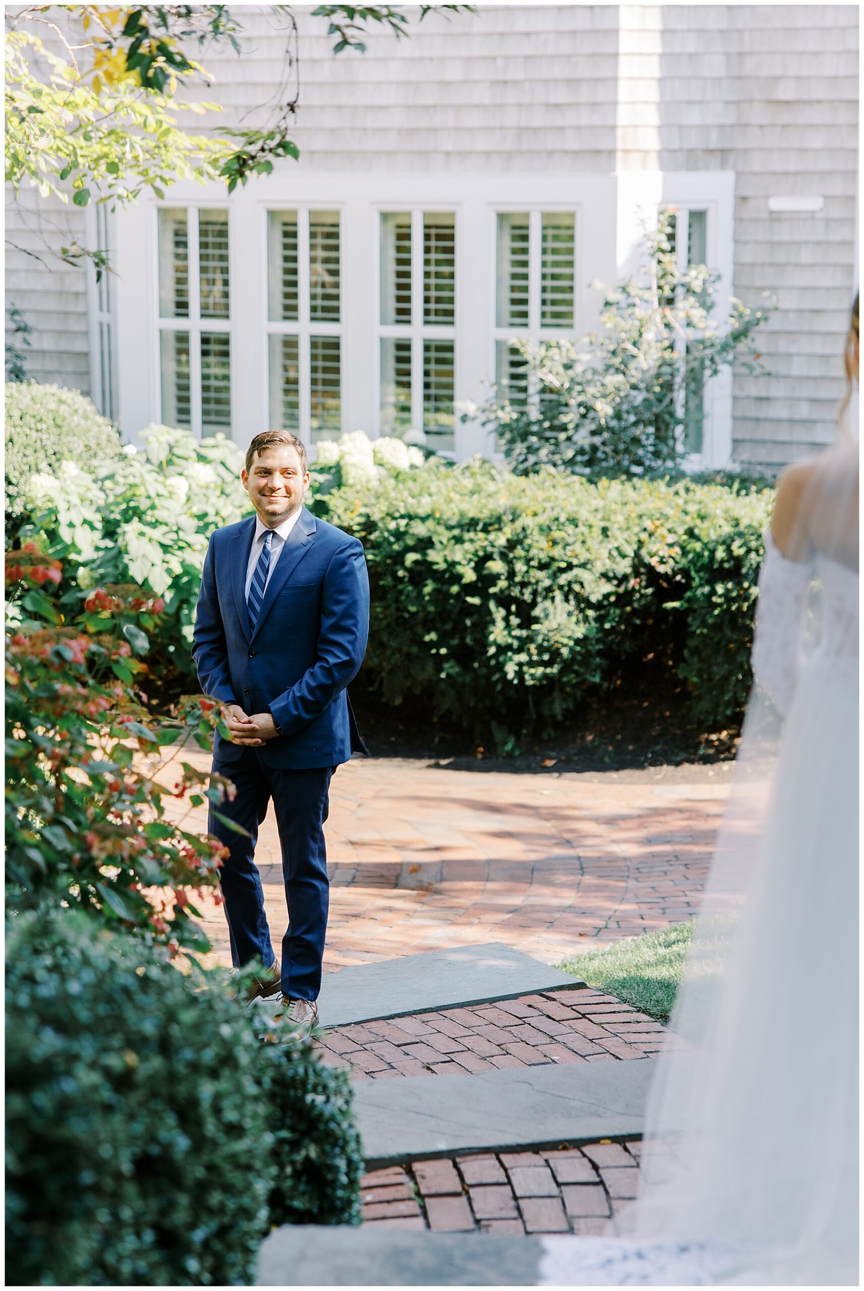 groom turns to see his bride for the first time on Cape Cod wedding day