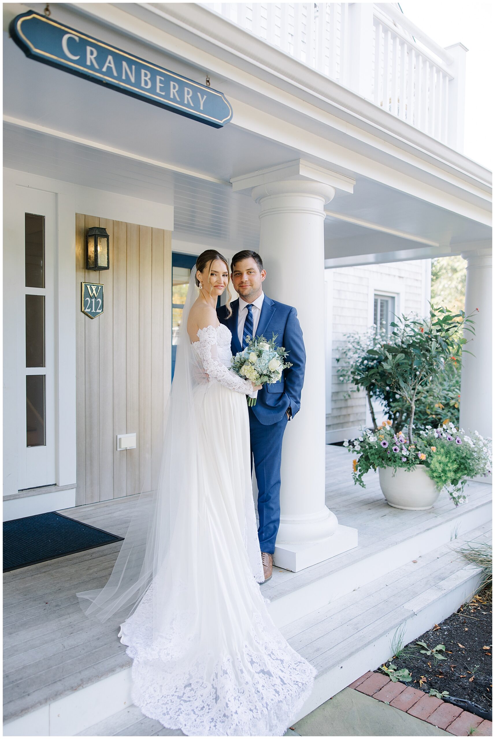 bride and groom outside building at Wequassett Resort at Cape Cod