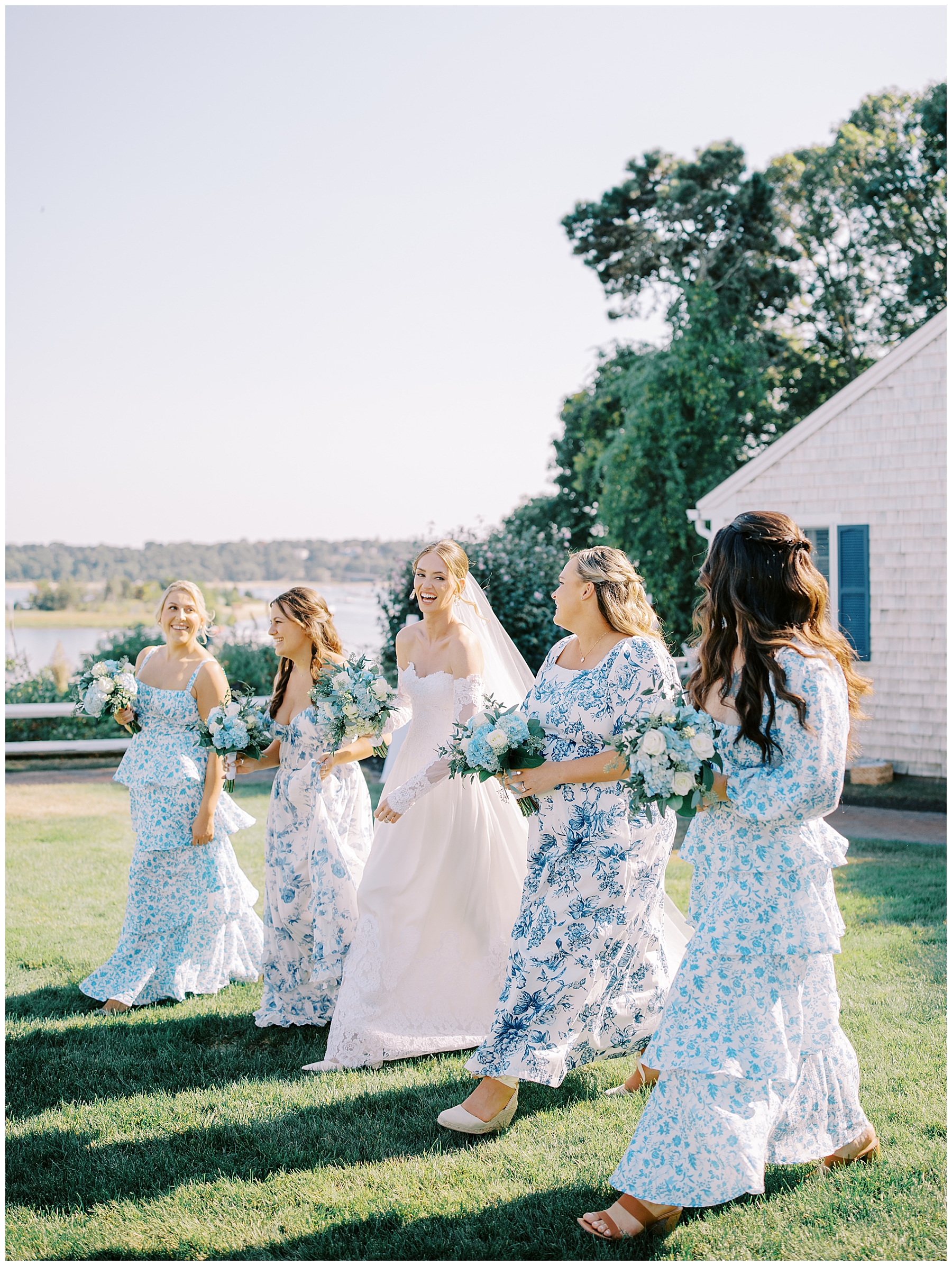 elegant bridesmaids' dresses in light blue and white floral patterns