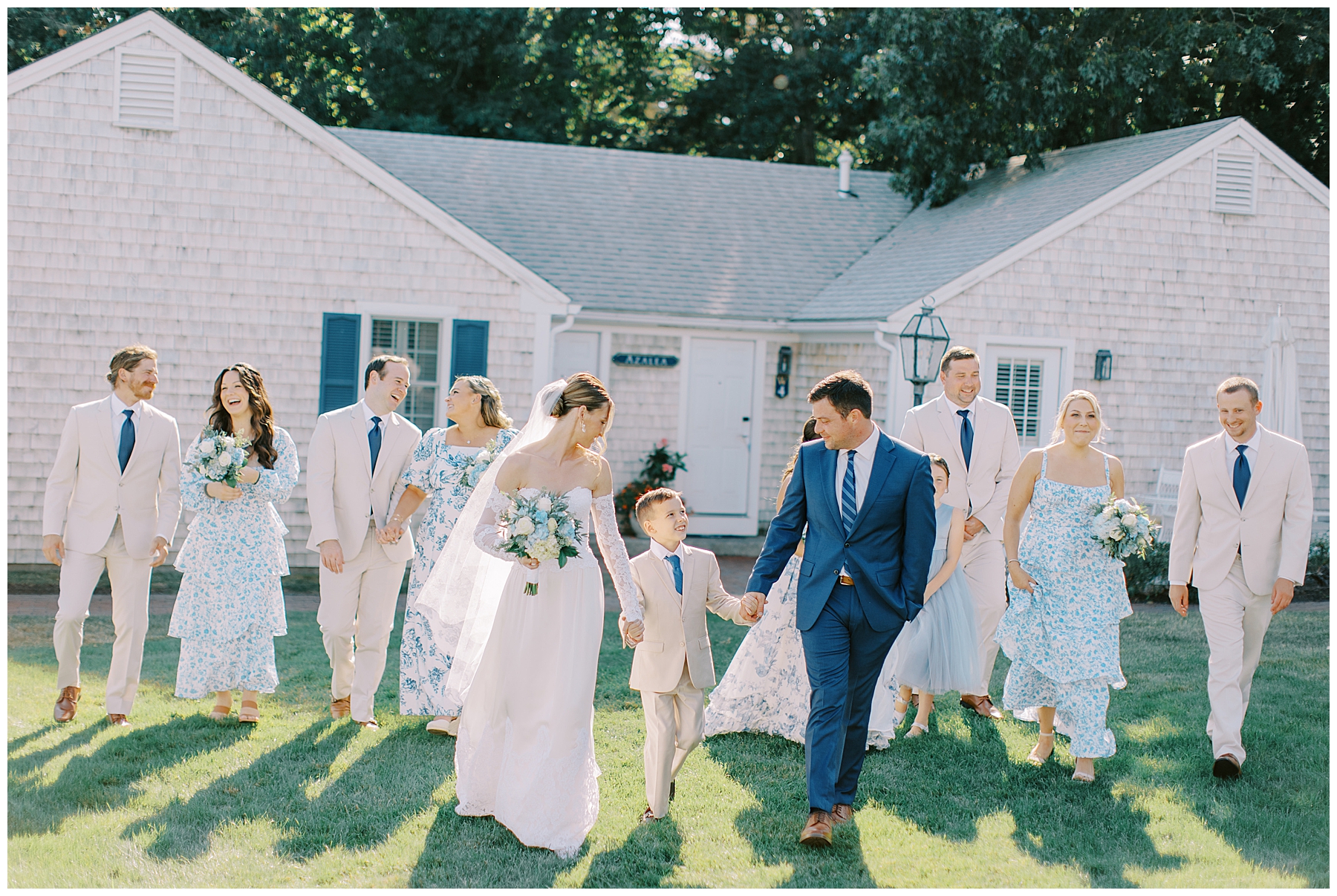 bride and groom walk together with wedding party