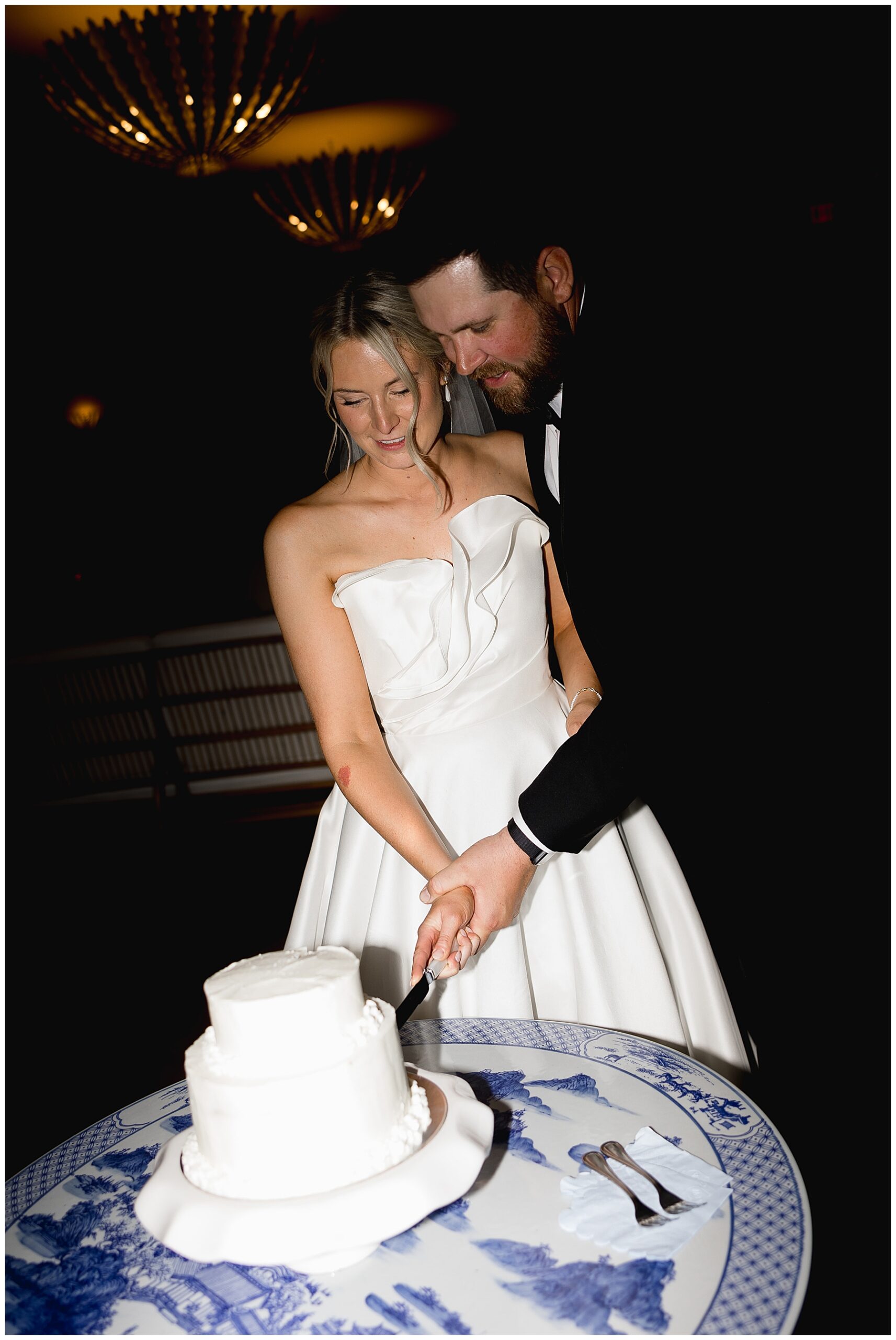 Newlyweds cut the wedding cake they made together