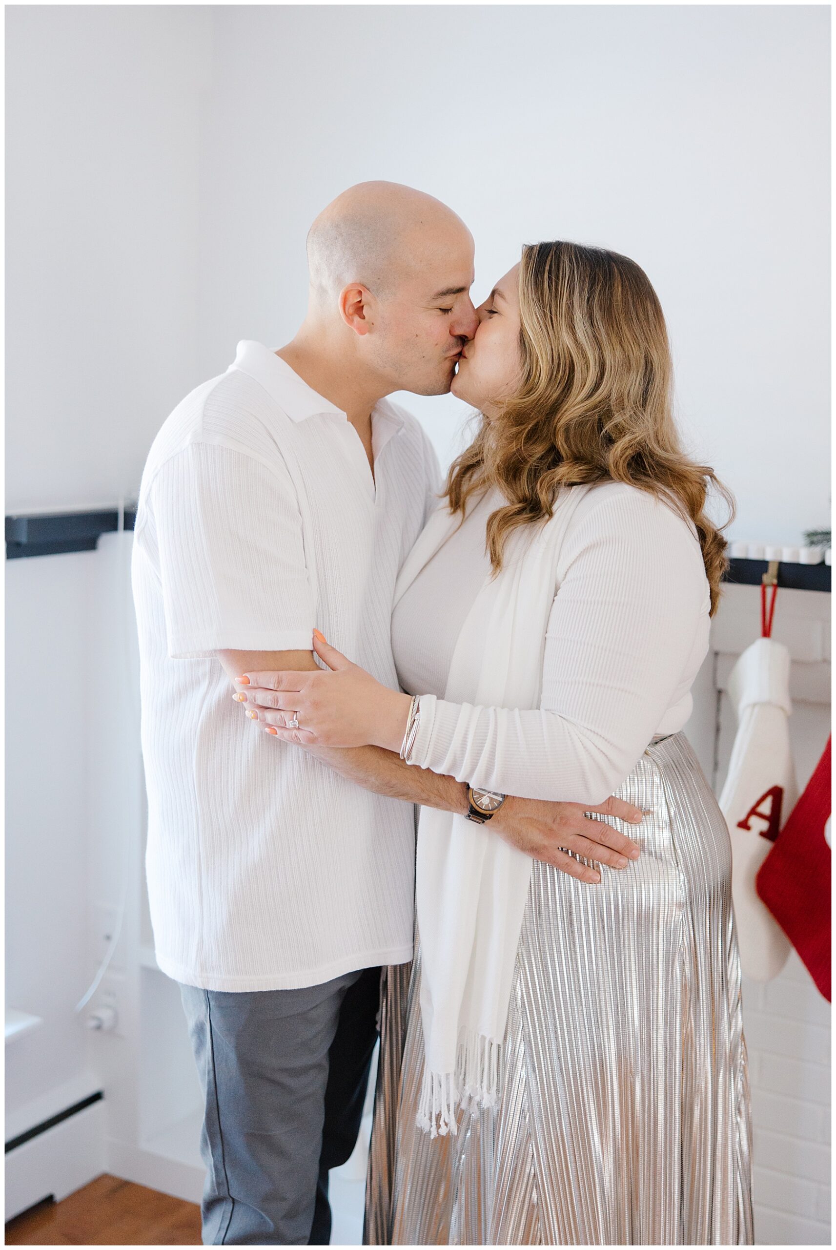 newly engaged couple kiss