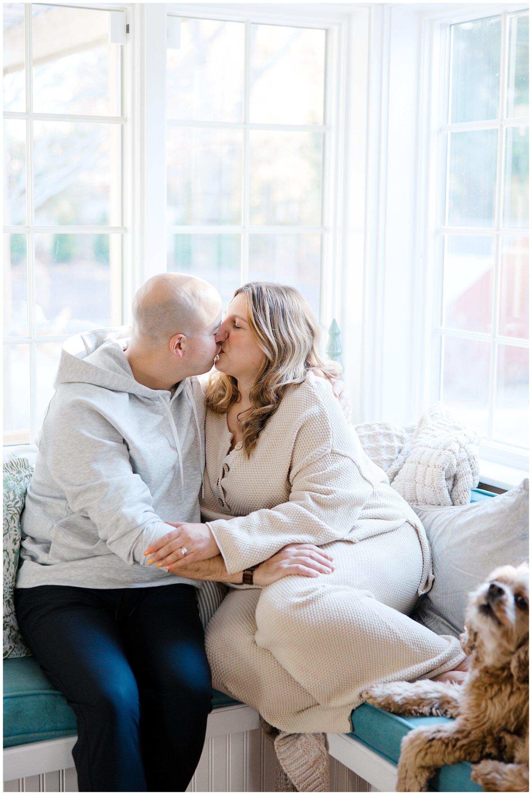 couple cozy up in corner of home