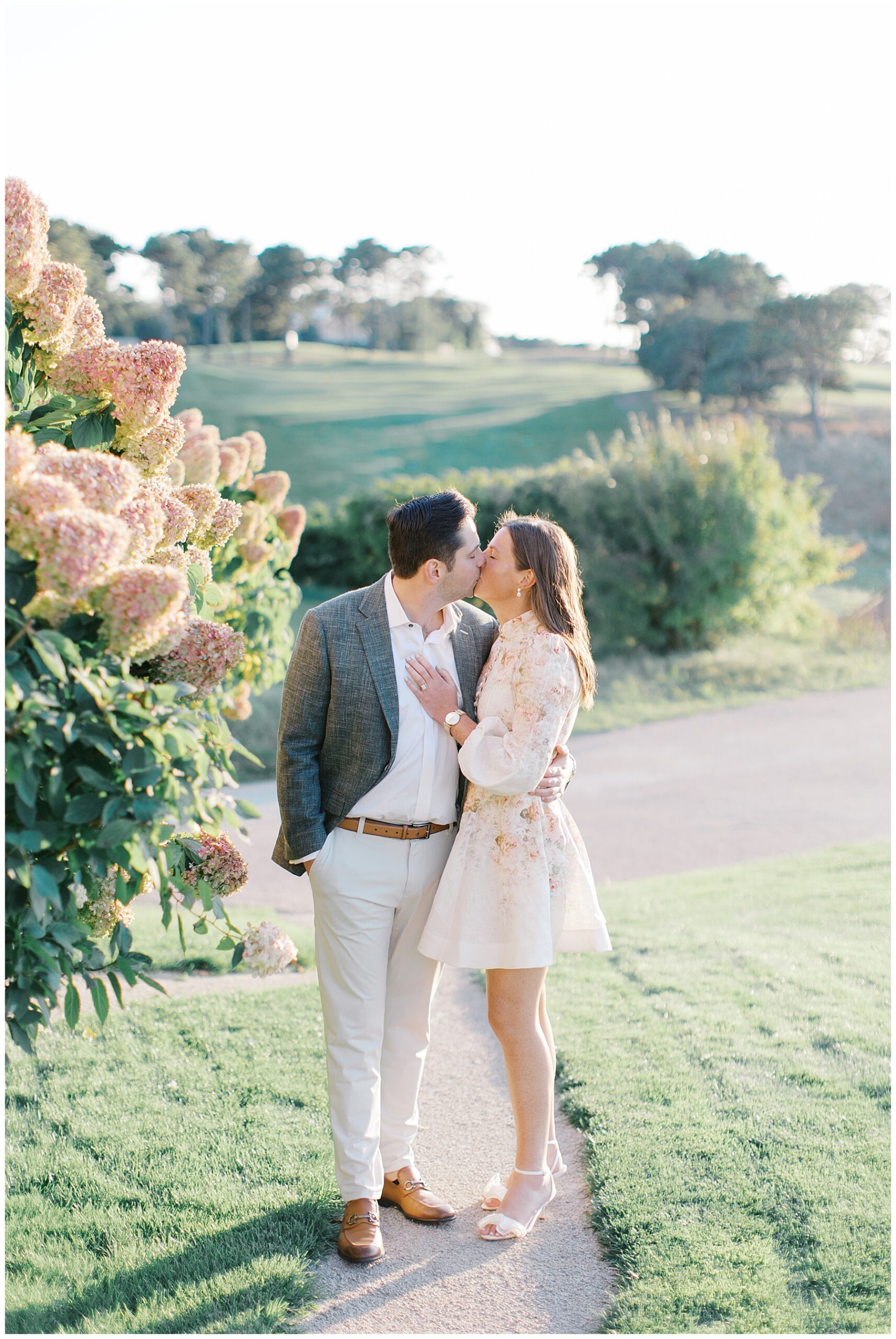 bride and groom to be kiss at wedding welcome party 