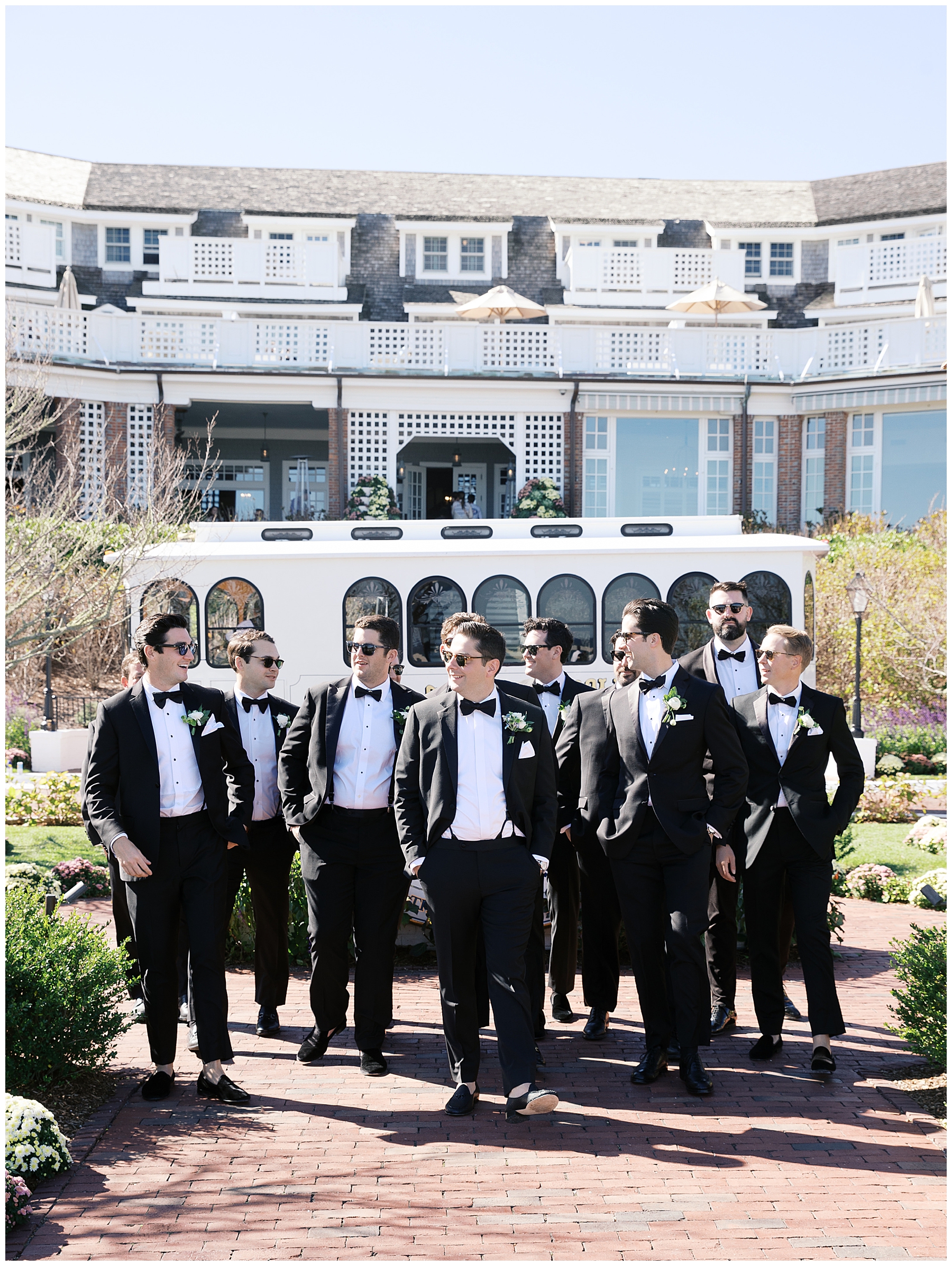 groom and groomsmen walking outside of Cape Cod venue 