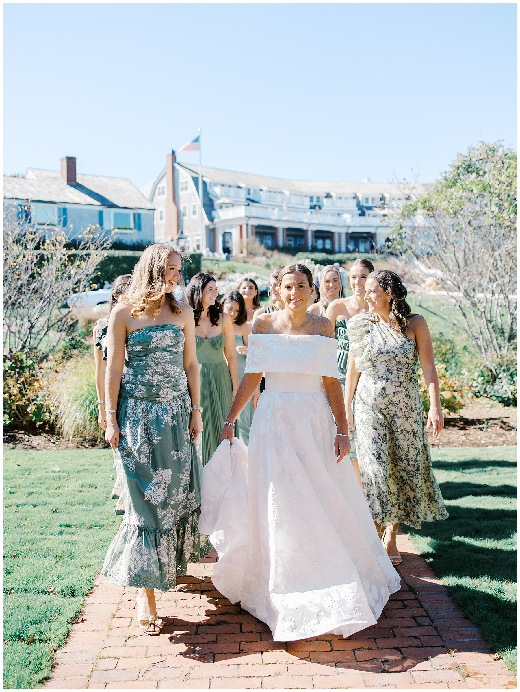 bride walking with bridesmaids 