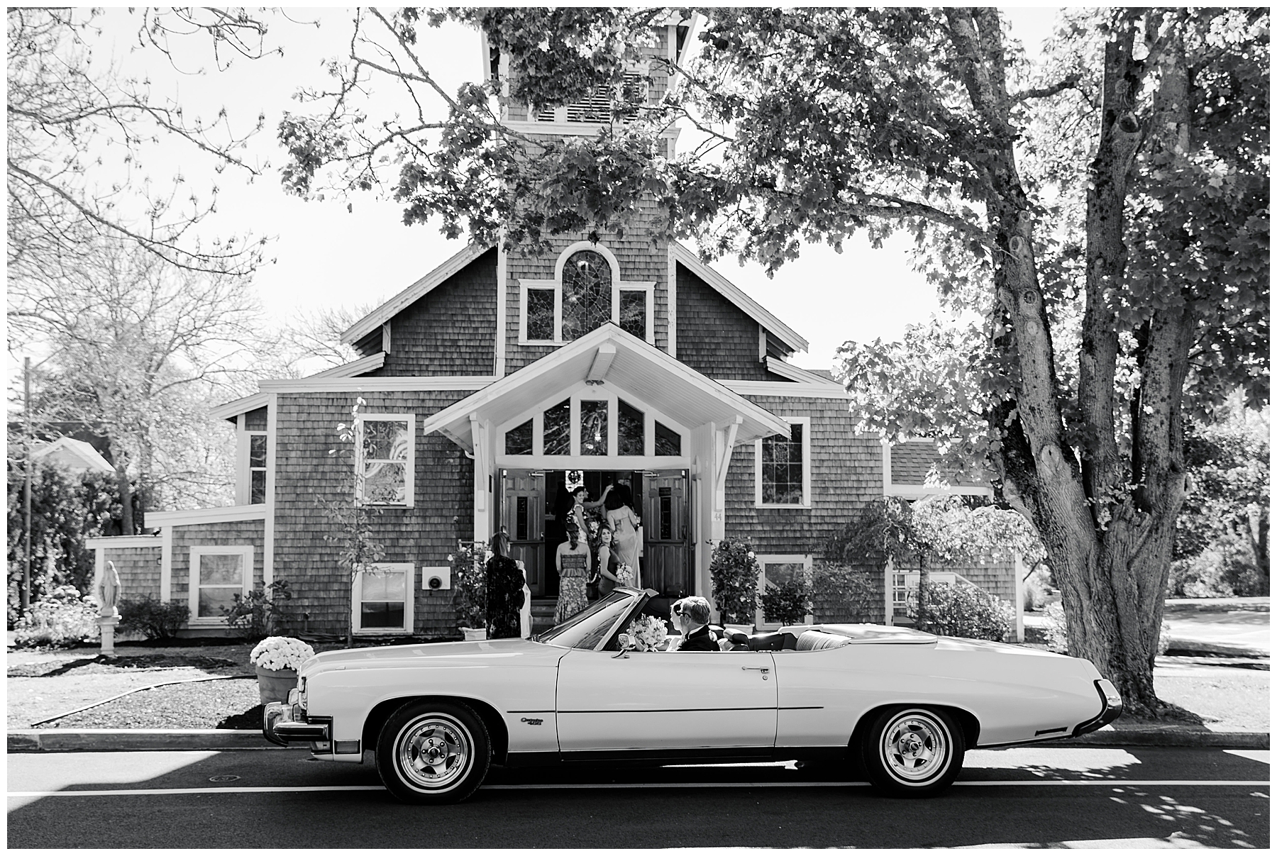 bride arrives at ceremony in vintage car