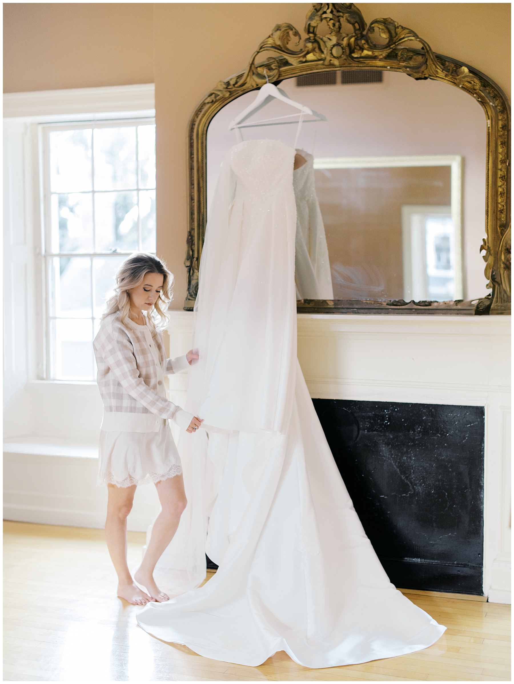 bride looking at wedding dress