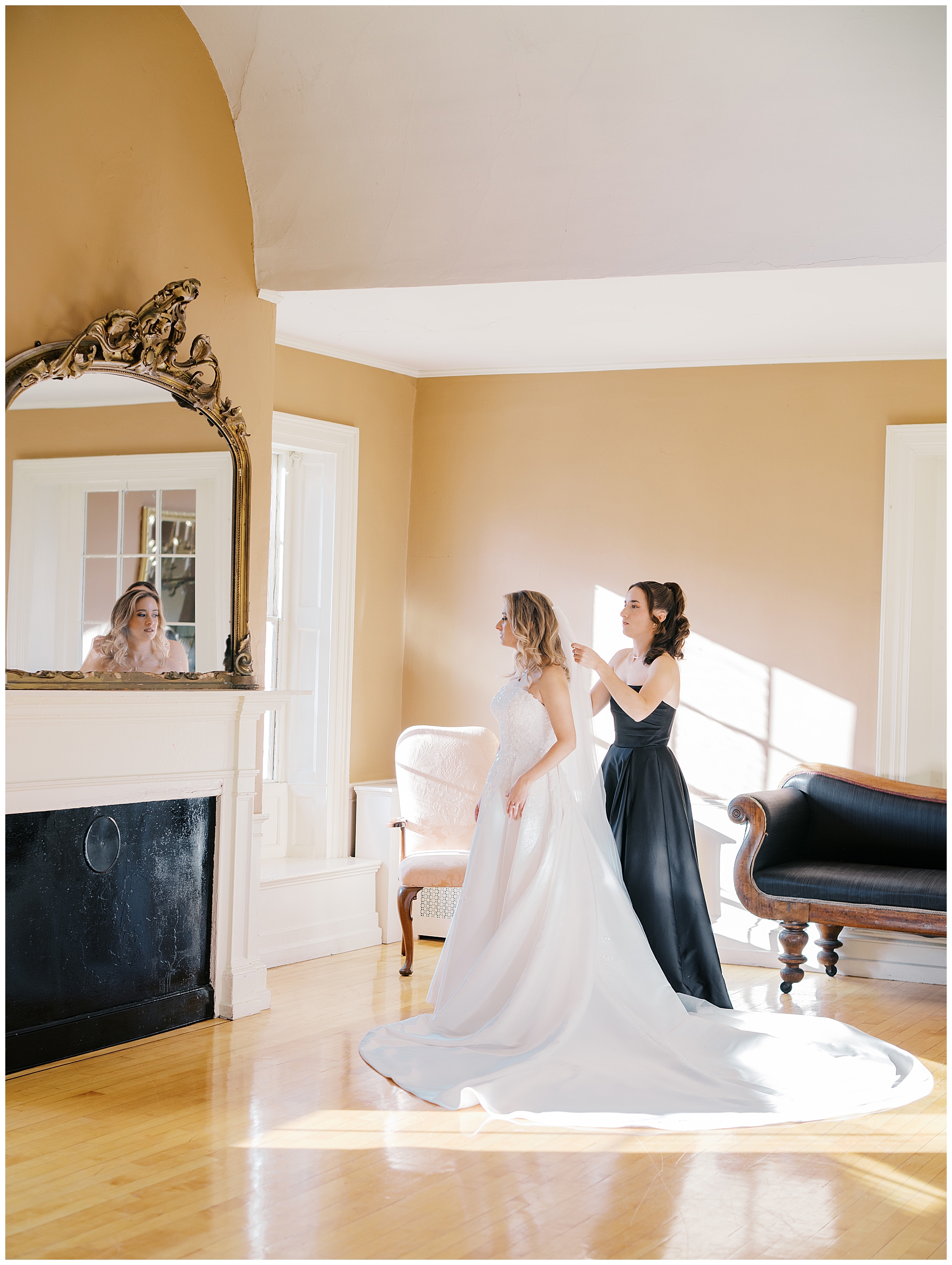 bride getting into wedding dress