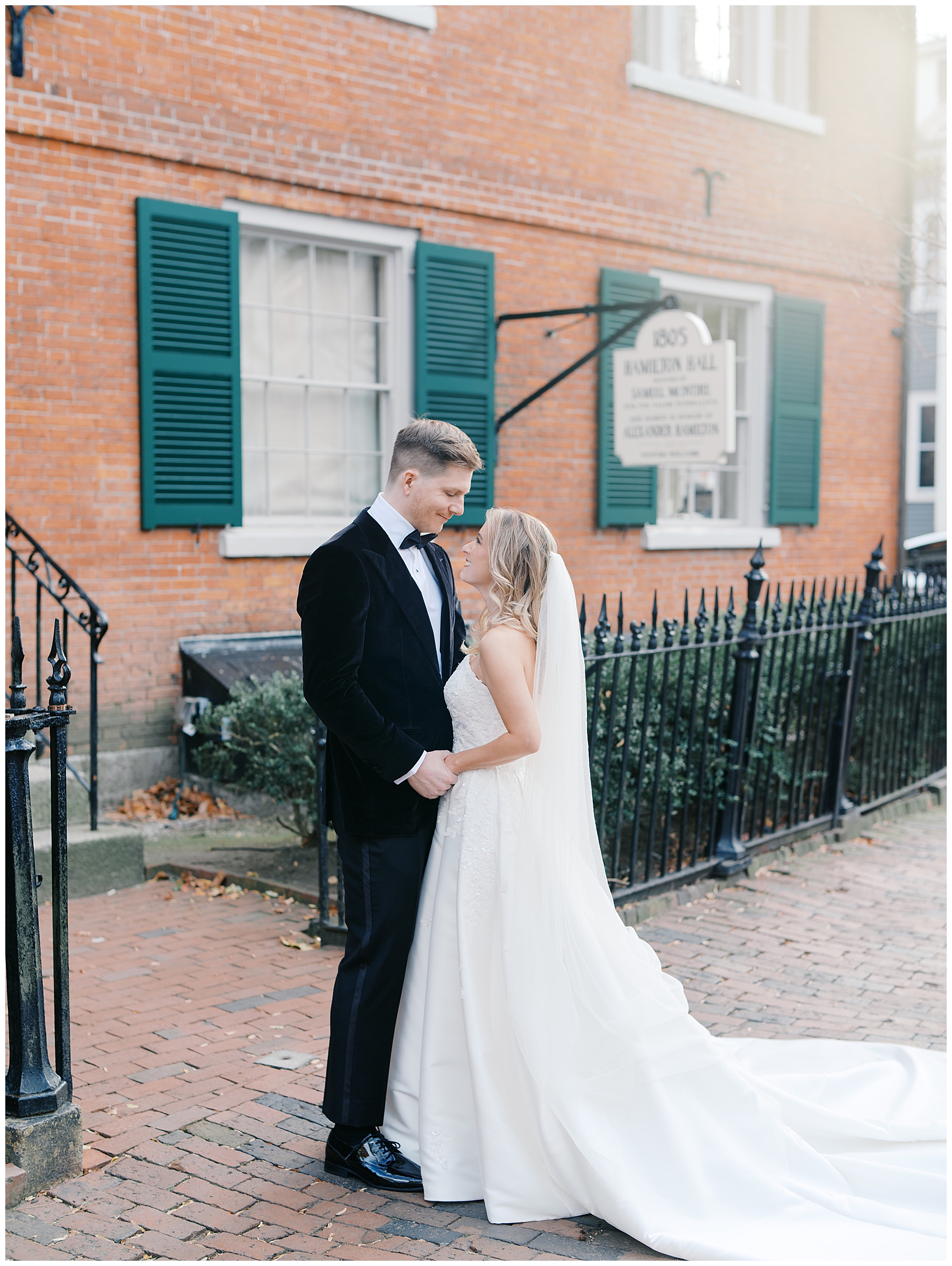 bride and groom outside of Hamilton Hall for wedding portraits
