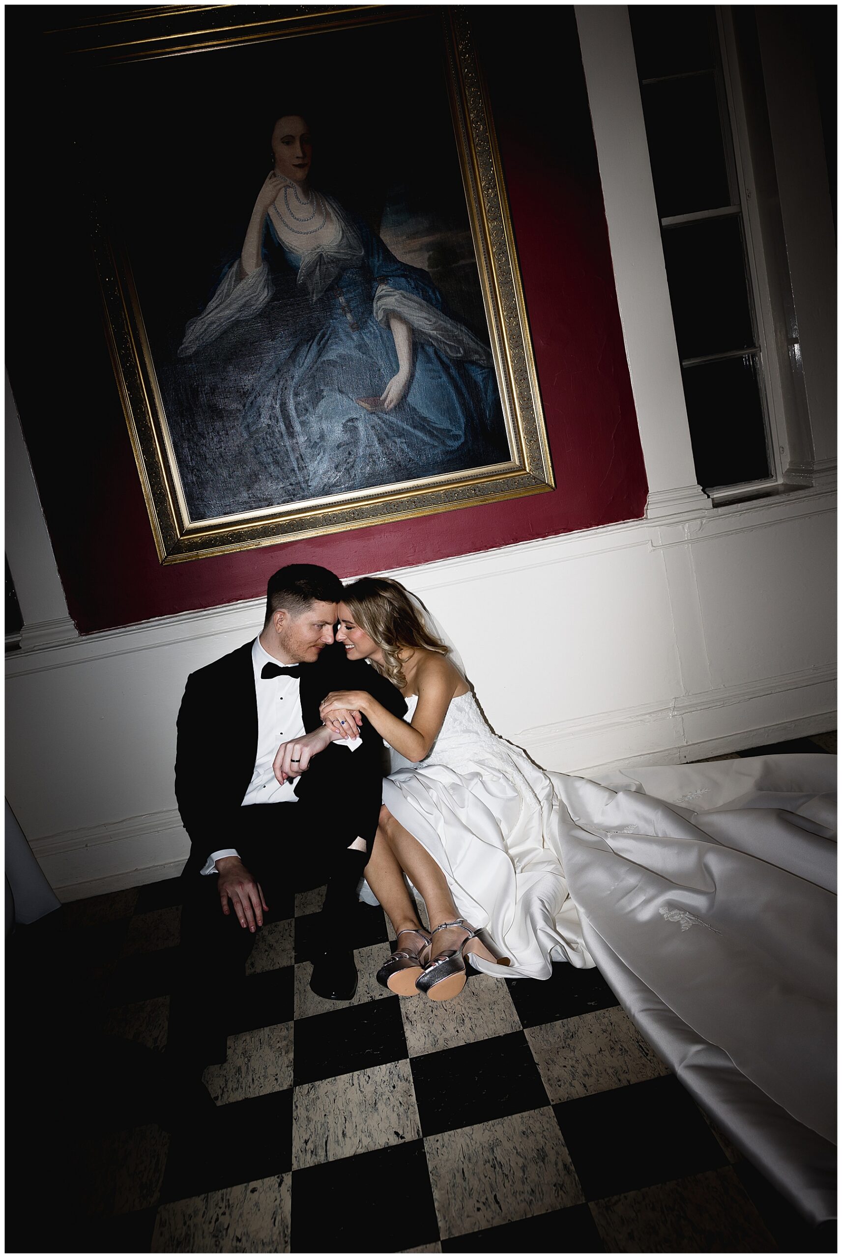 bride and groom portraits under painting