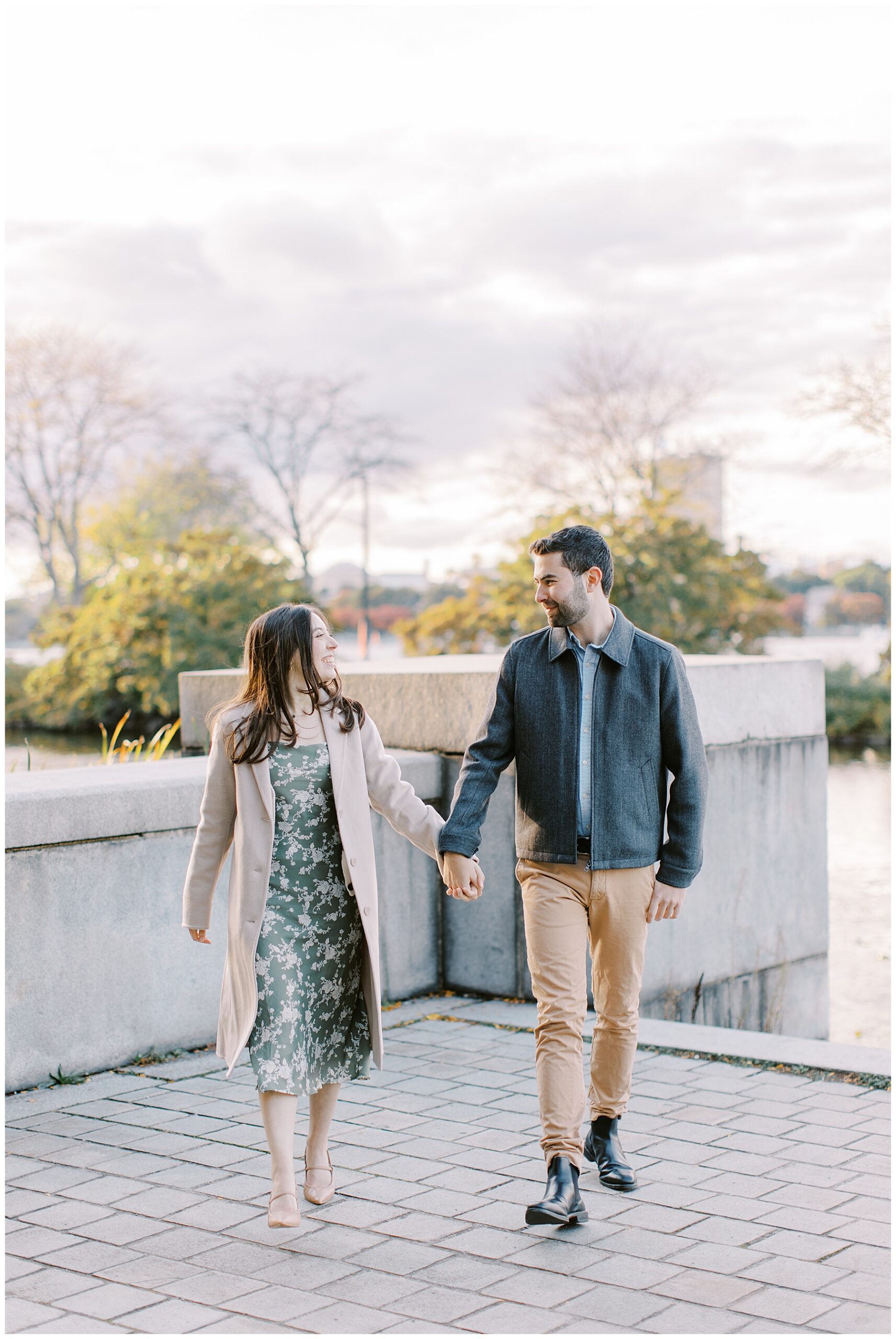 couple walk together holding hands 