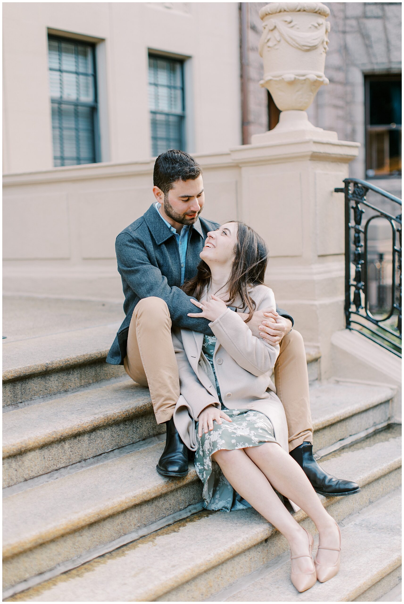 couple sit on stairs together 