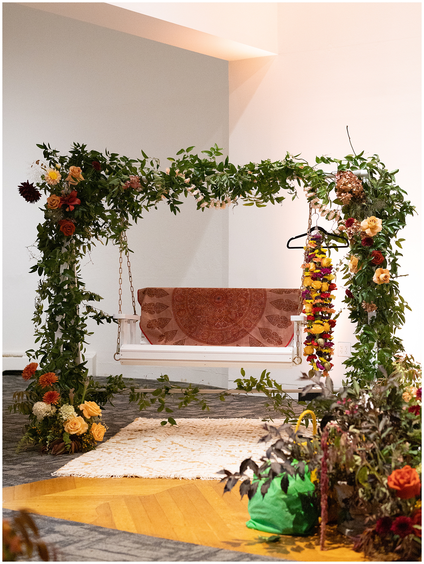 florals and greenery decorate swing at South Indian wedding ceremony