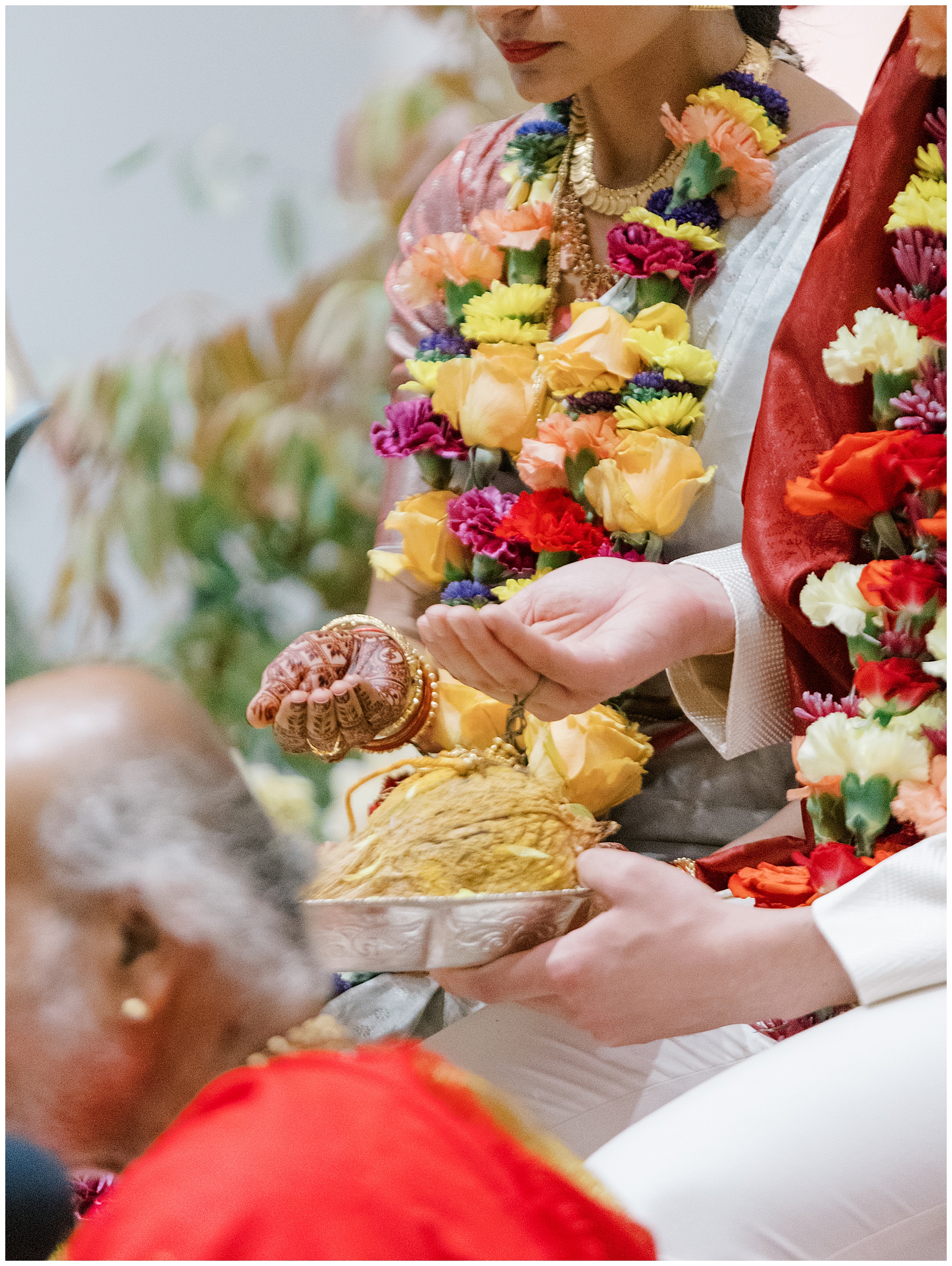 bride snd groom with flower necklaces