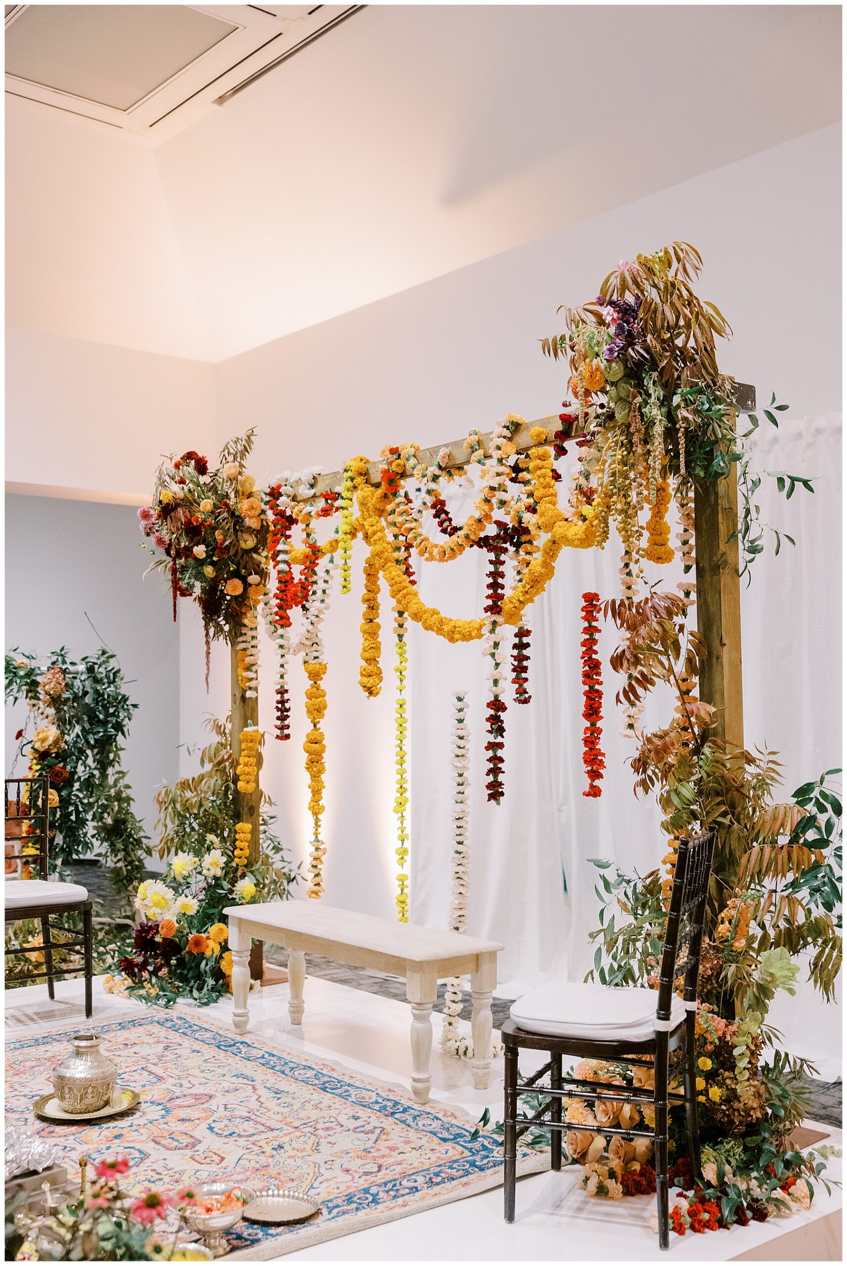 colorful flowers decorate ceremony space at South Indian Wedding