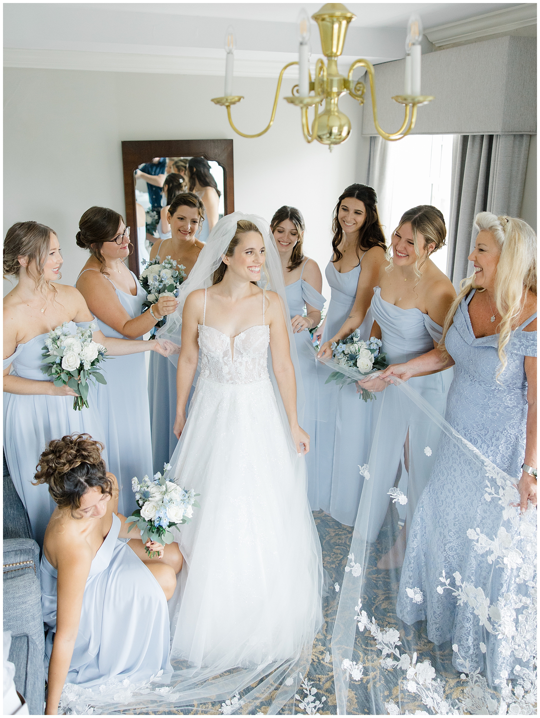 bridal party standing around bride 