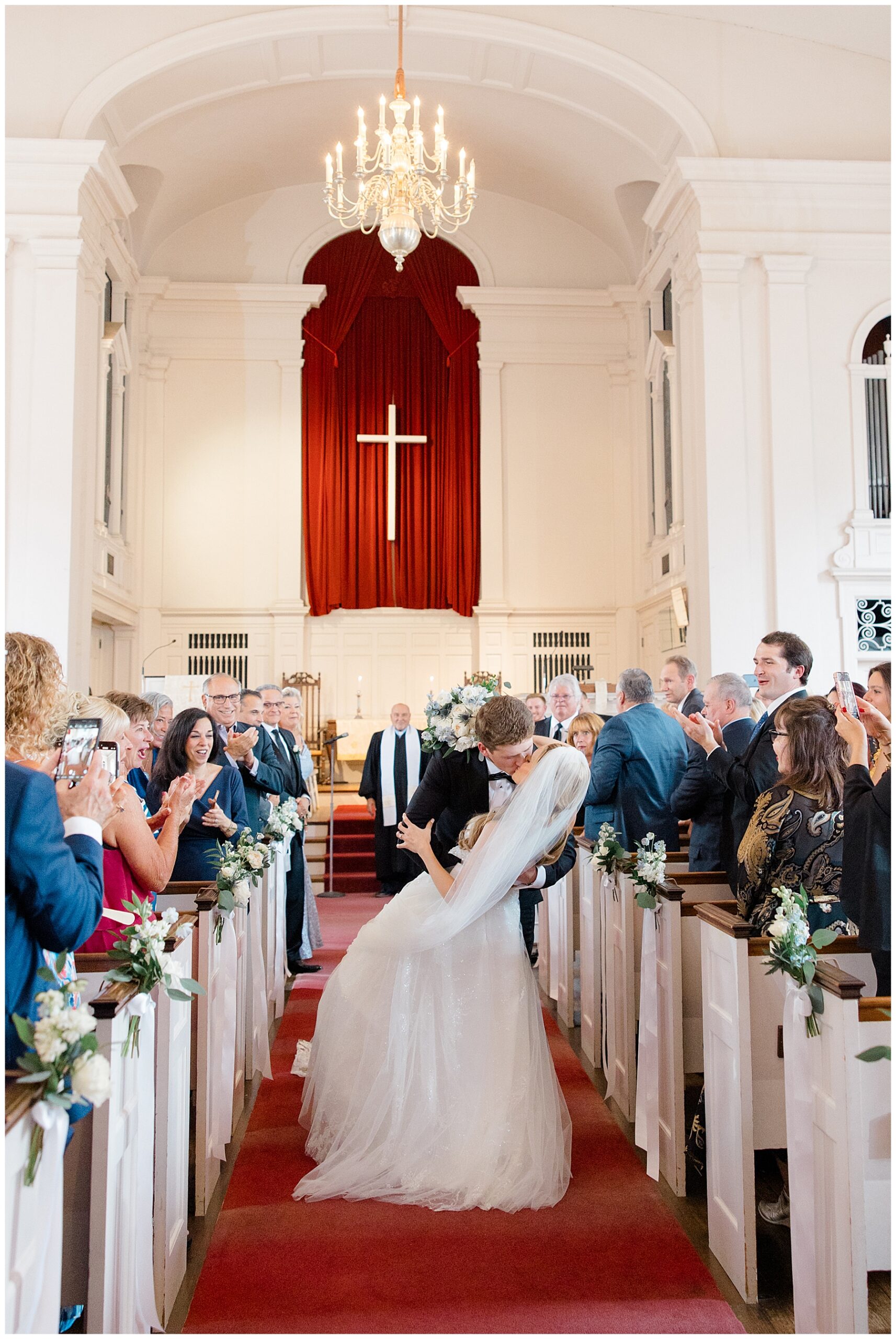 newlyweds kiss as they exit church
