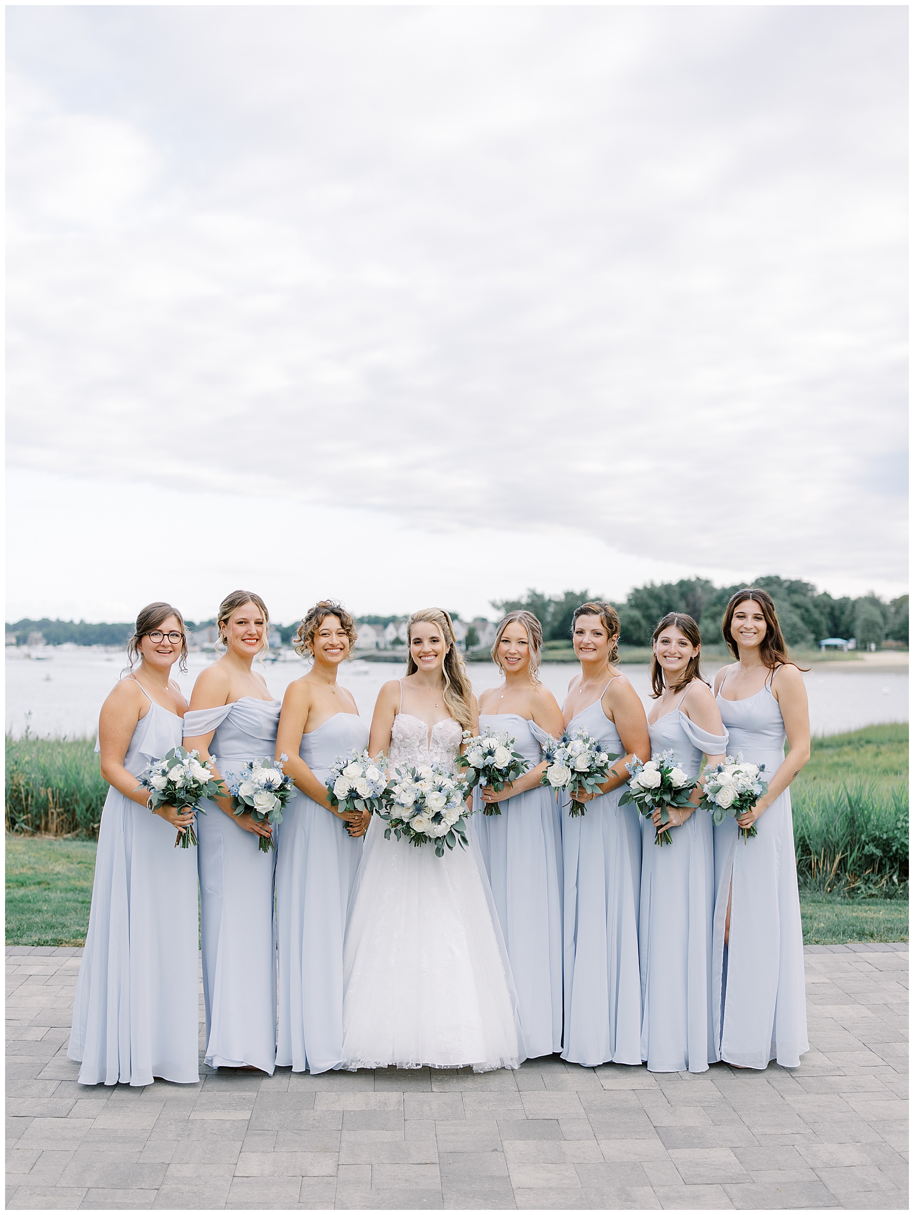 bride with bridesmaids in light blue bridesmaids dresses 