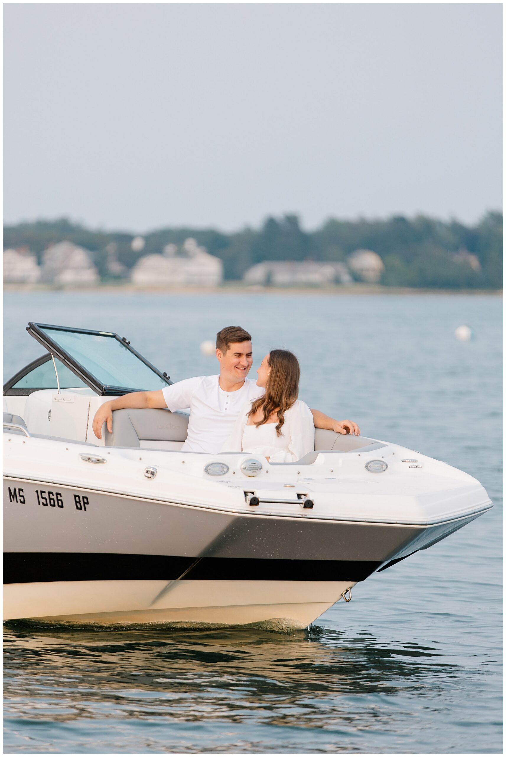 romantic engagement portraits on a boat in Cape Cod