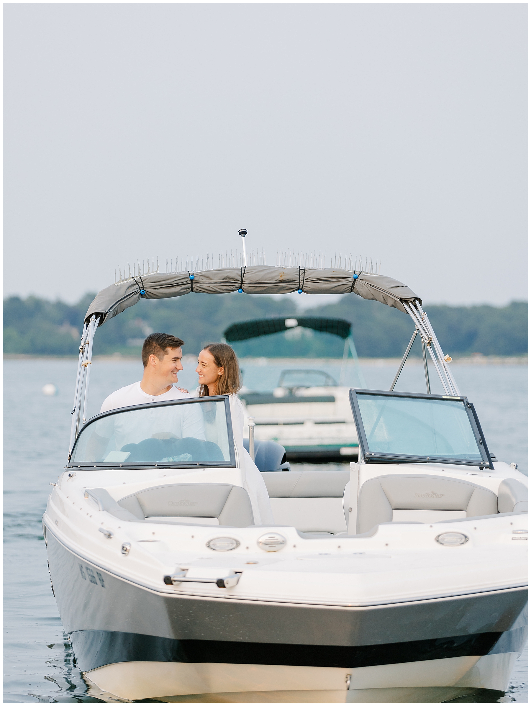 engaged couple on boat 