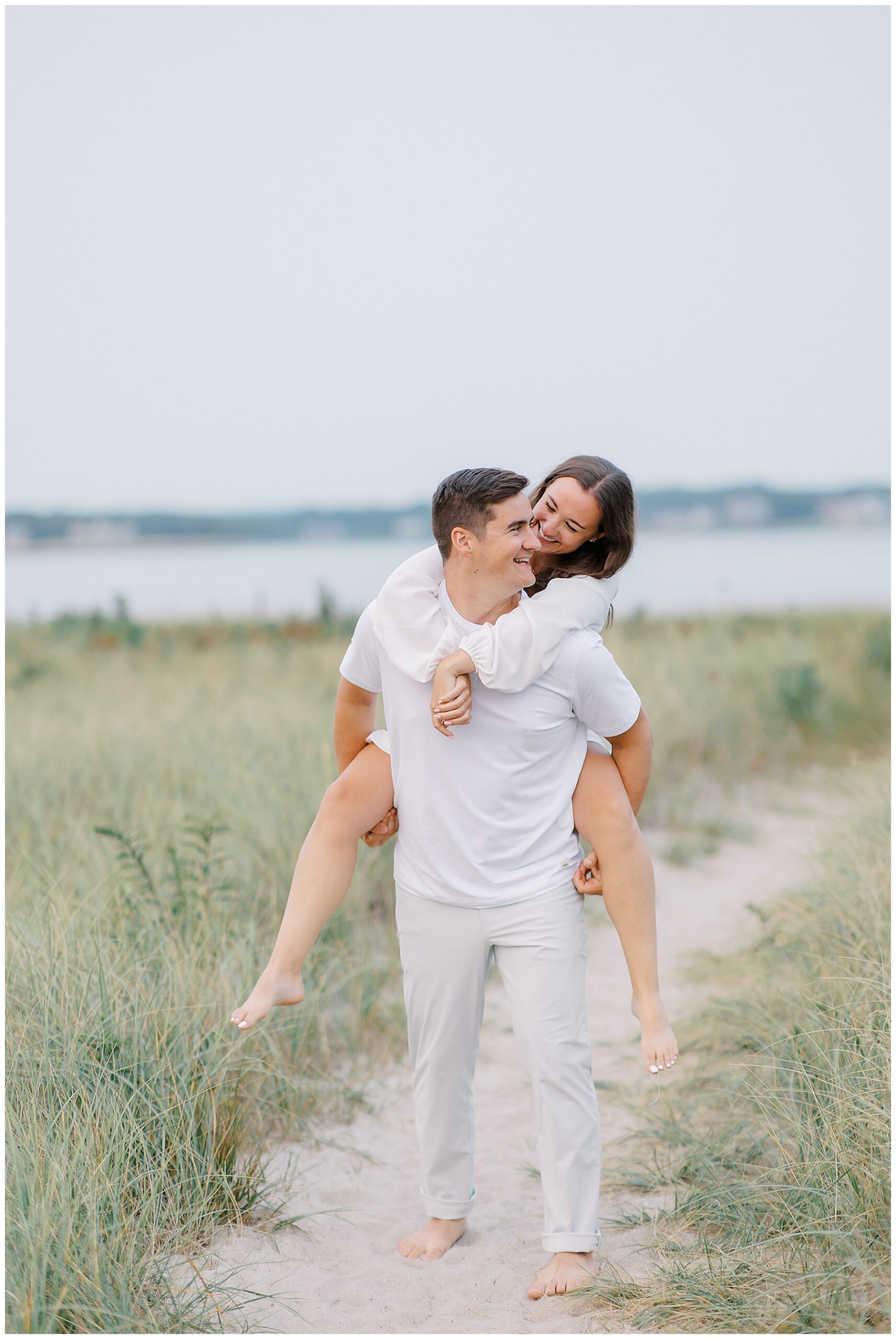 guy carries fiancé on his back