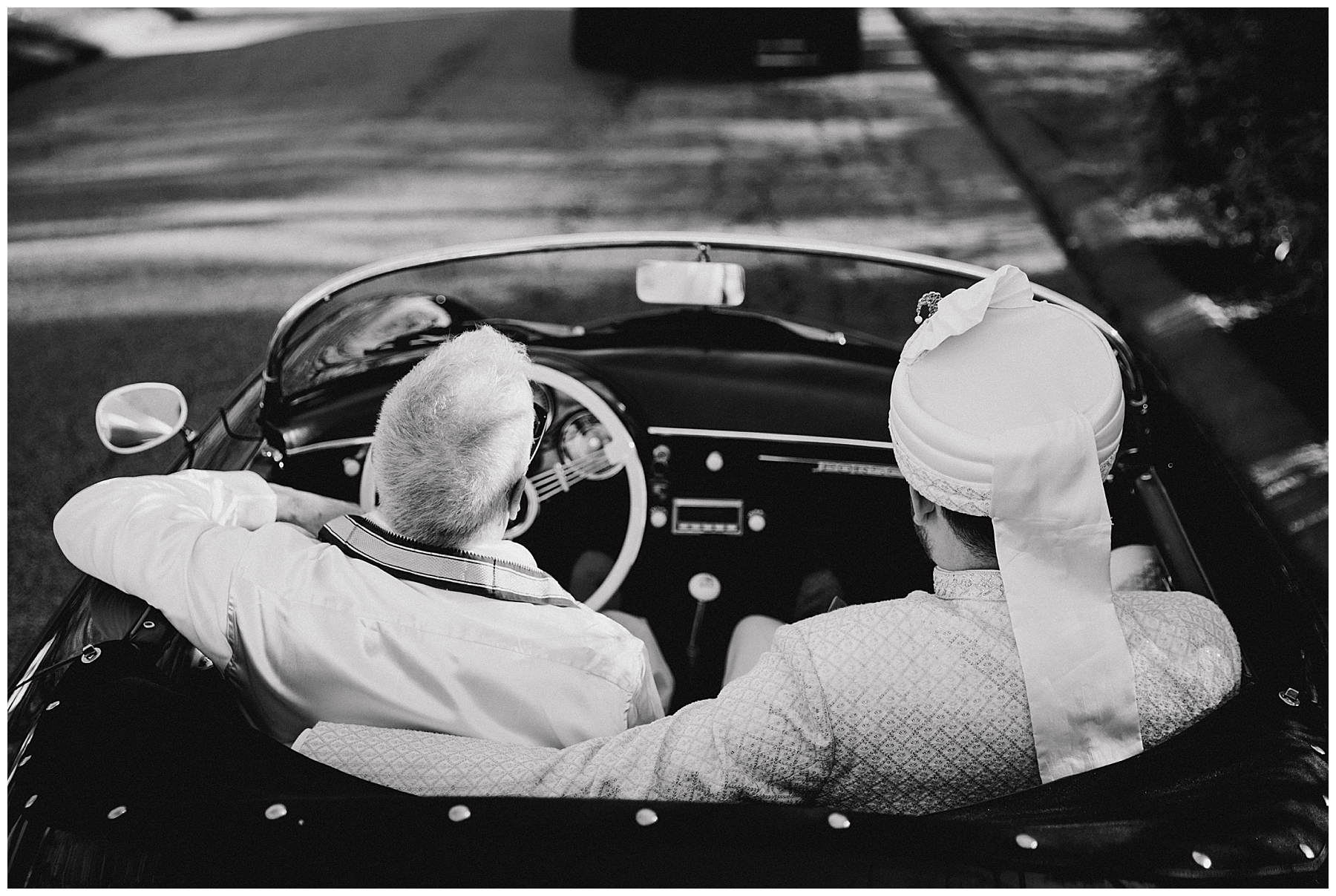 groom and father driving in classic car