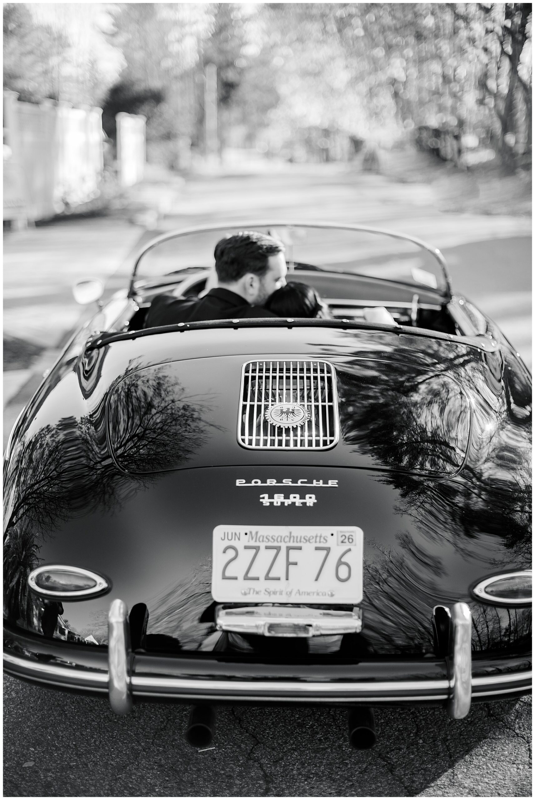 newlyweds drive away in classic porsche