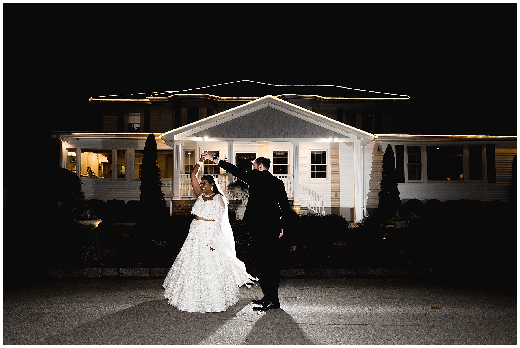 newlyweds dance outside building