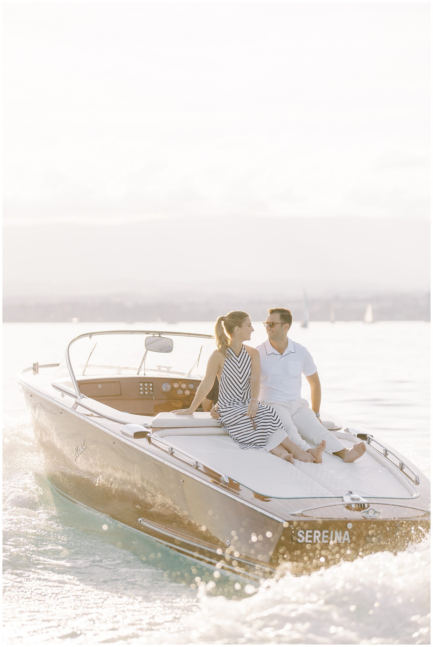 couple ride on boat on Lake Geneva in Lausanne, Switzerland