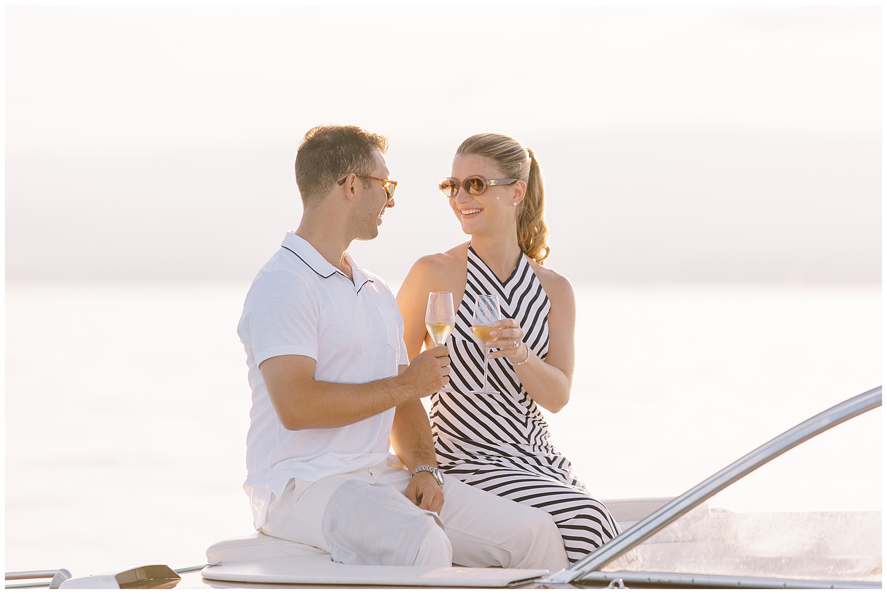 couple have champagne on boat ride
