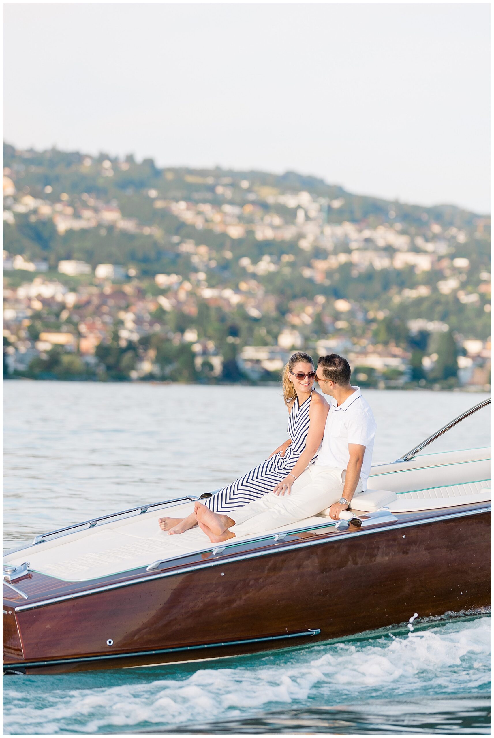 couple ride on back of boat