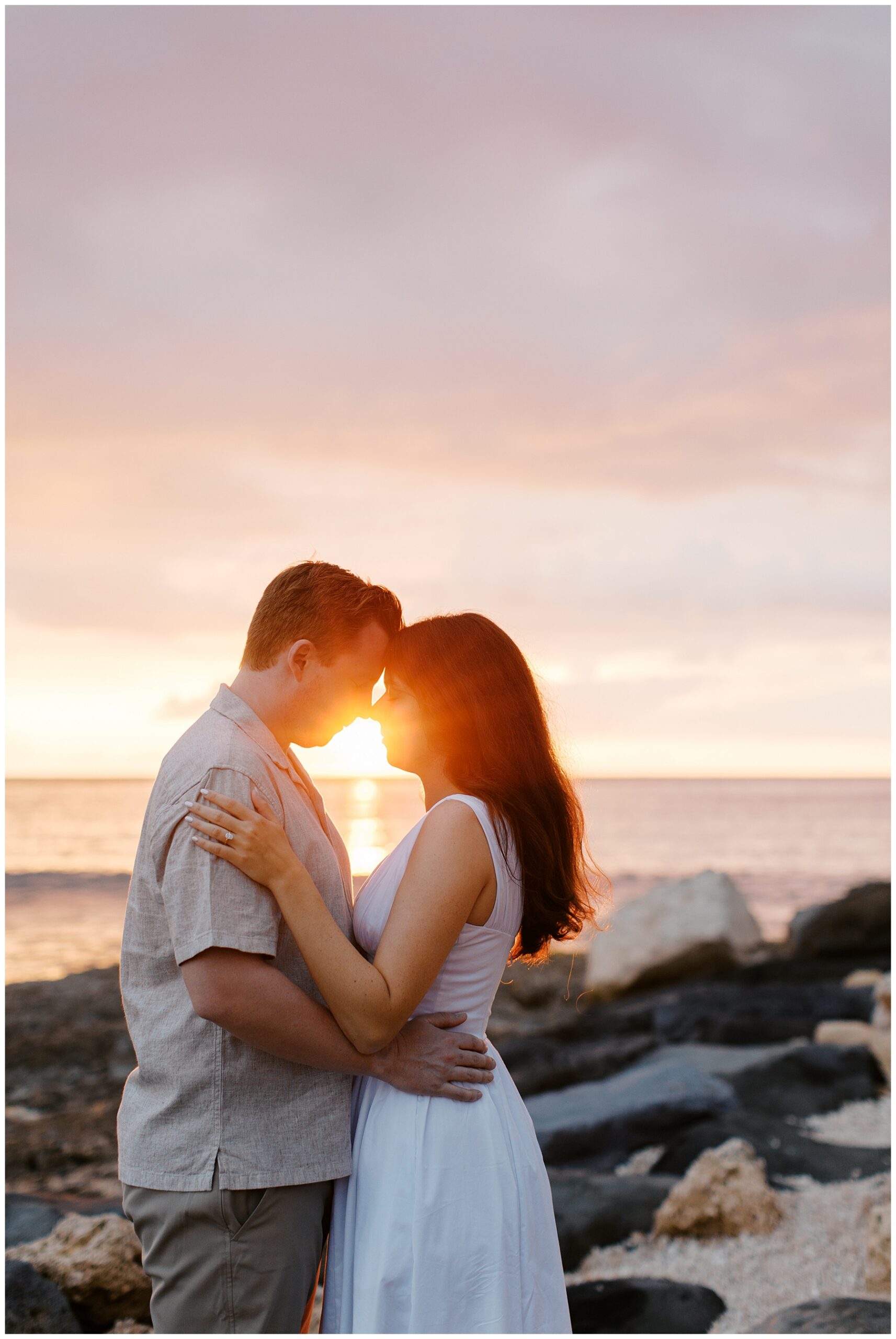 Sunset engagement photos in O'ahu Hawaii