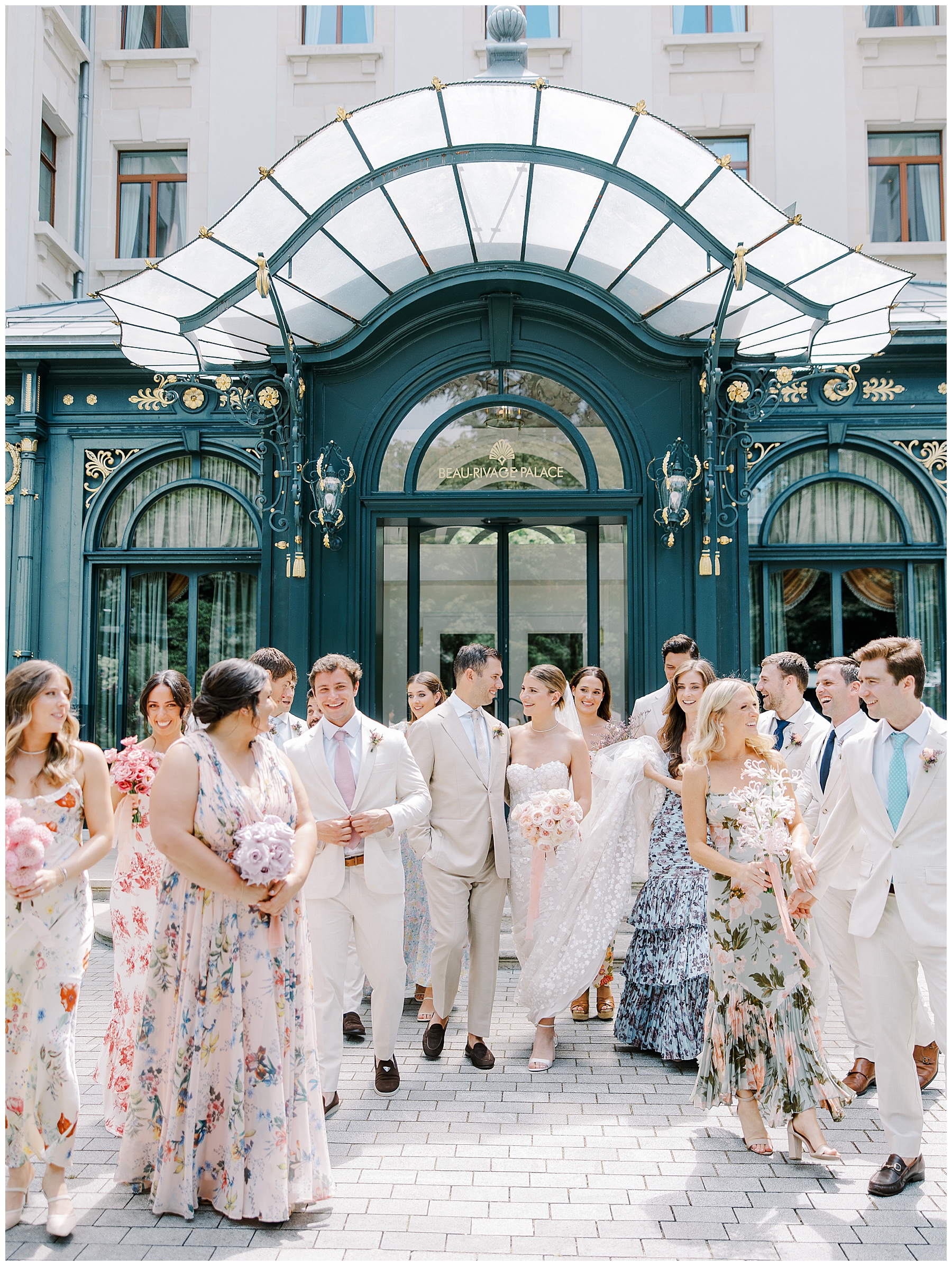 wedding party surround bride and groom from destination wedding in Switzerland