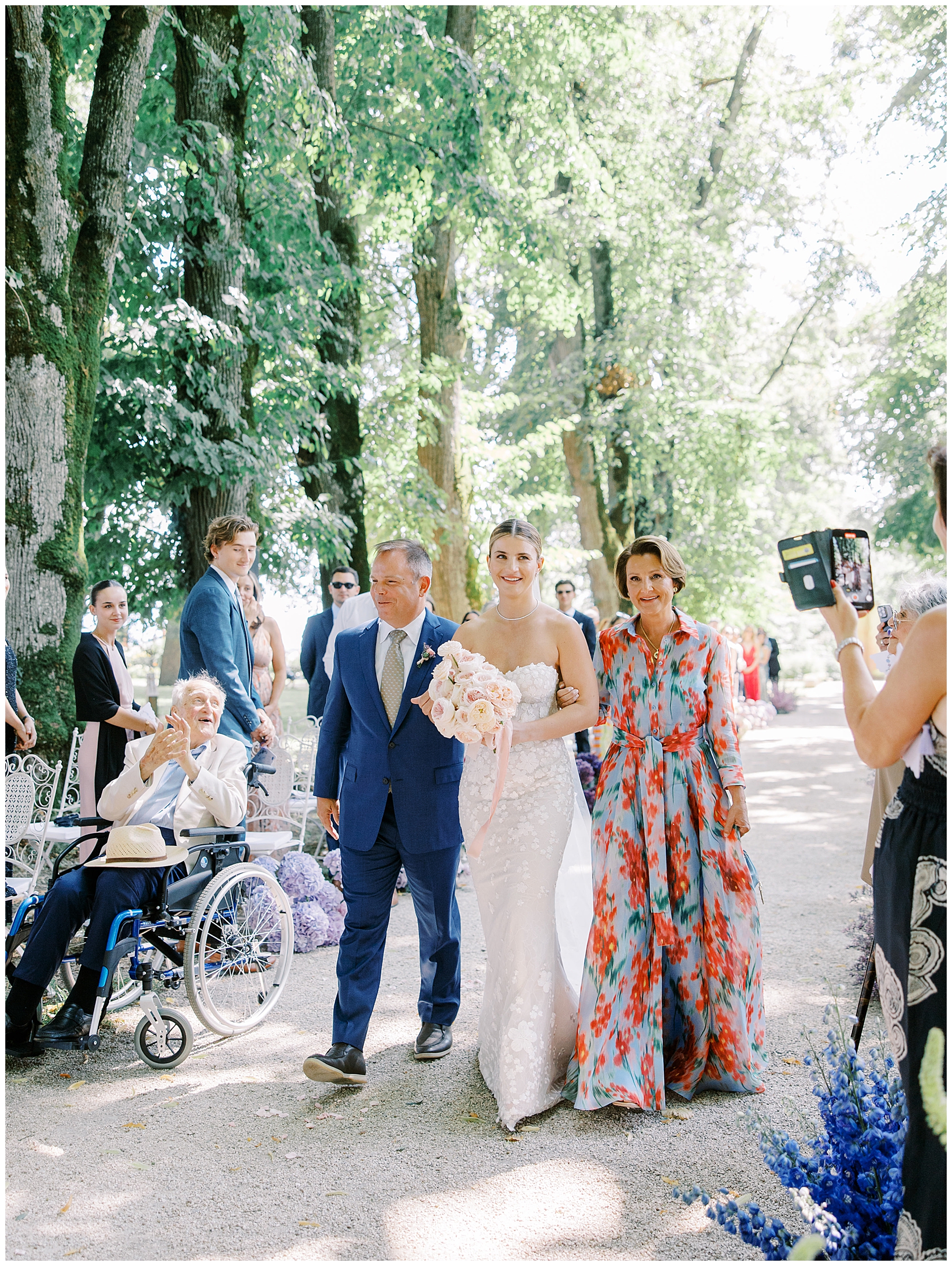 parents walk their daughter down the aisle