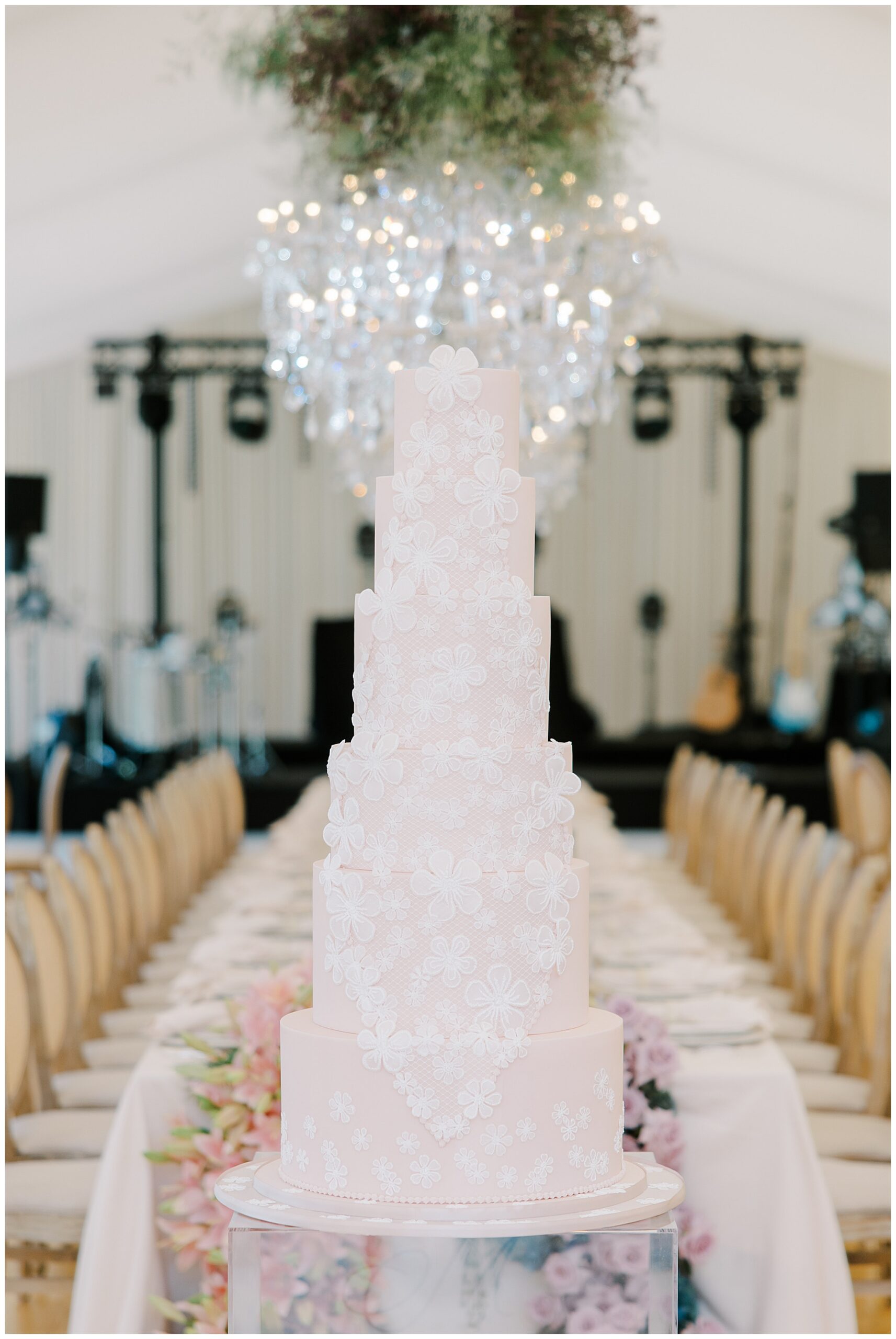 stunning wedding cake that replicates details from bride's wedding dress