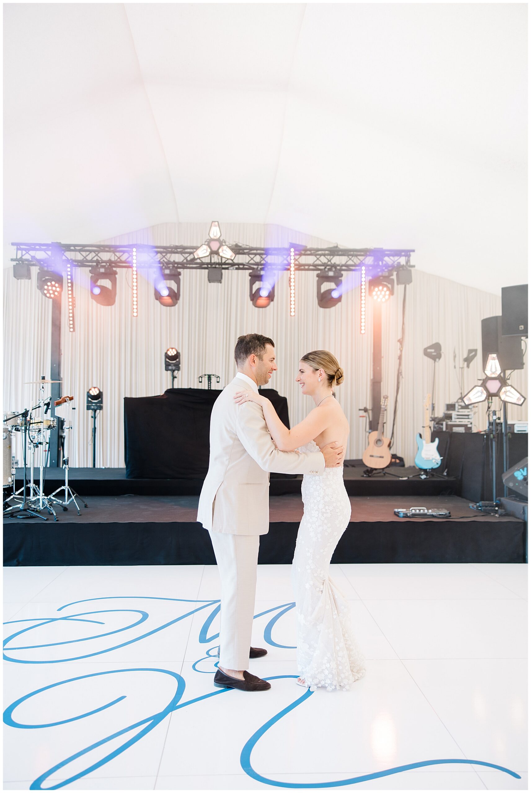bride and groom on dance floor with custom wrap