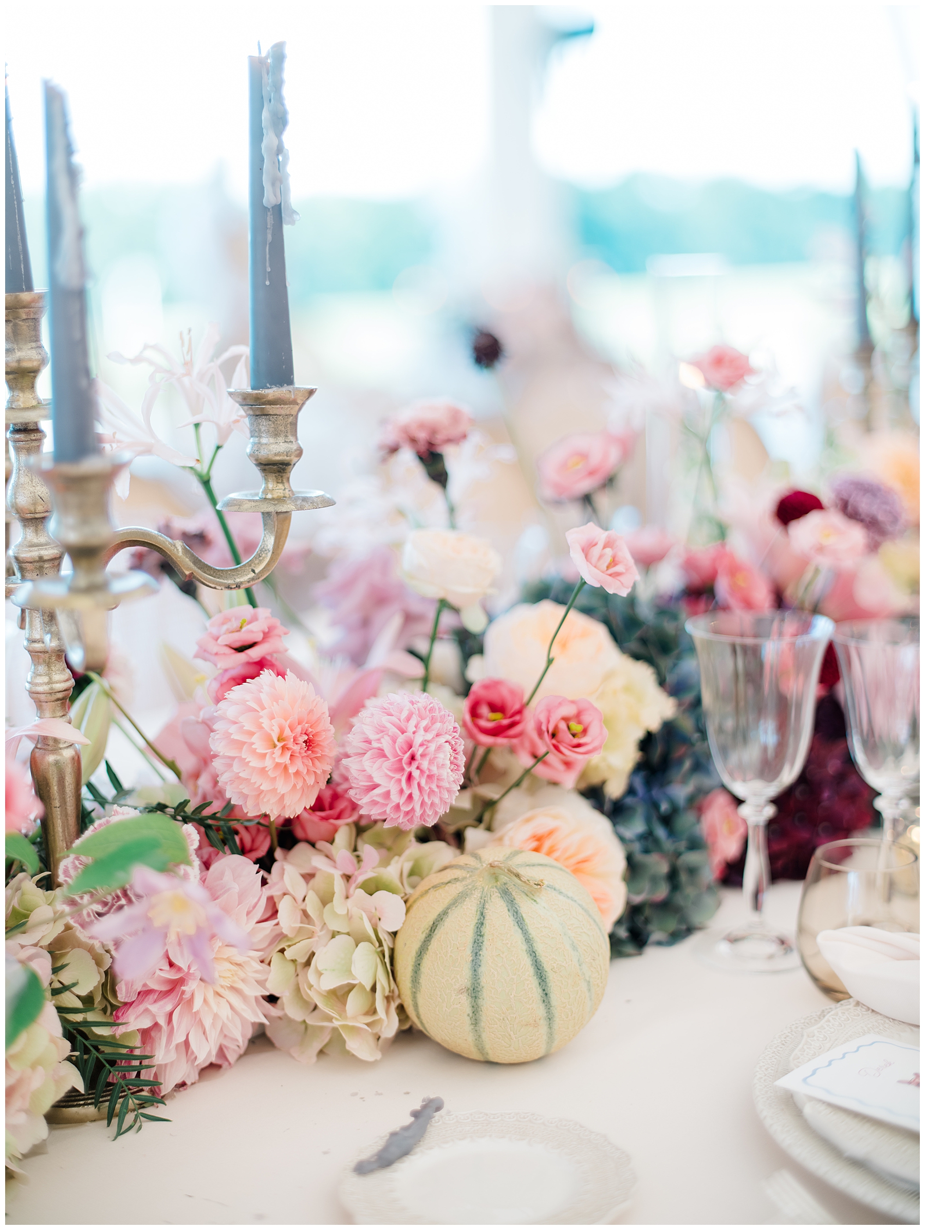 lush florals and fresh fruit decorate tables at wedding reception at Porte de Iris in Switzerland
