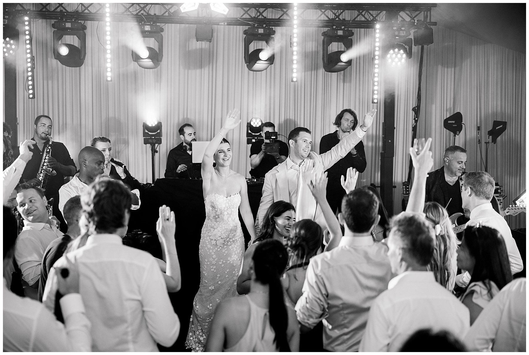 newlyweds and guests on dance floor