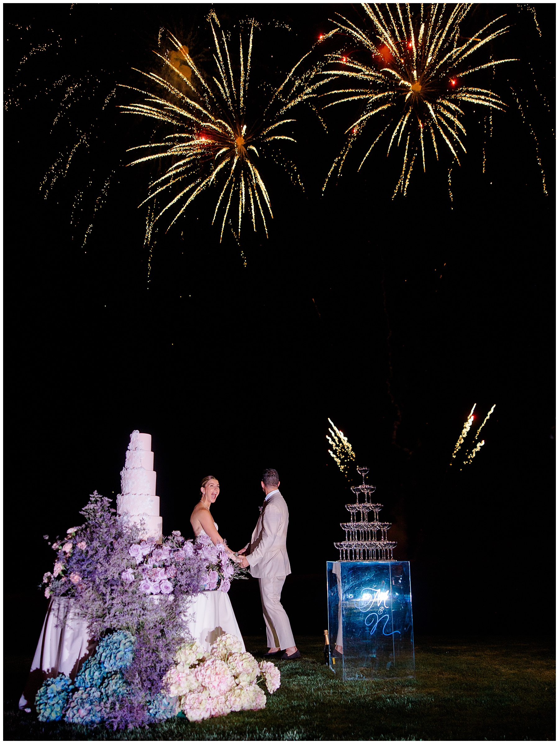 shocked bride and groom are surprised with fireworks