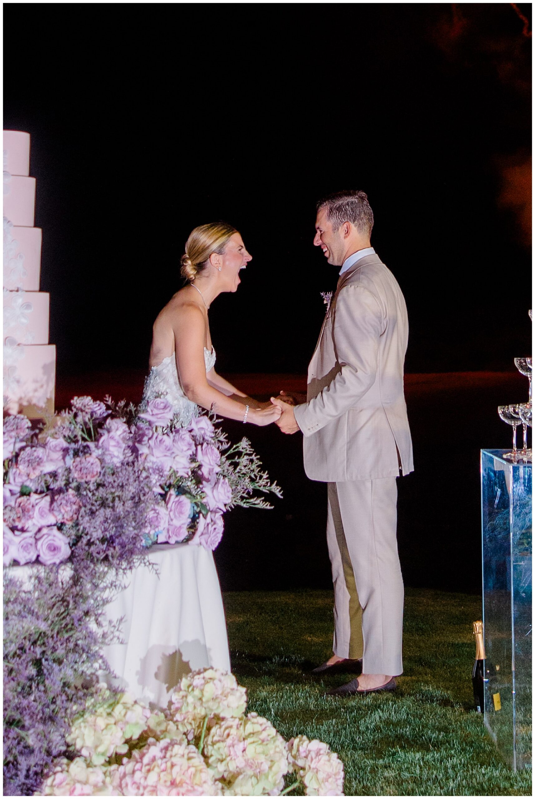 surprised bride and groom during firework show