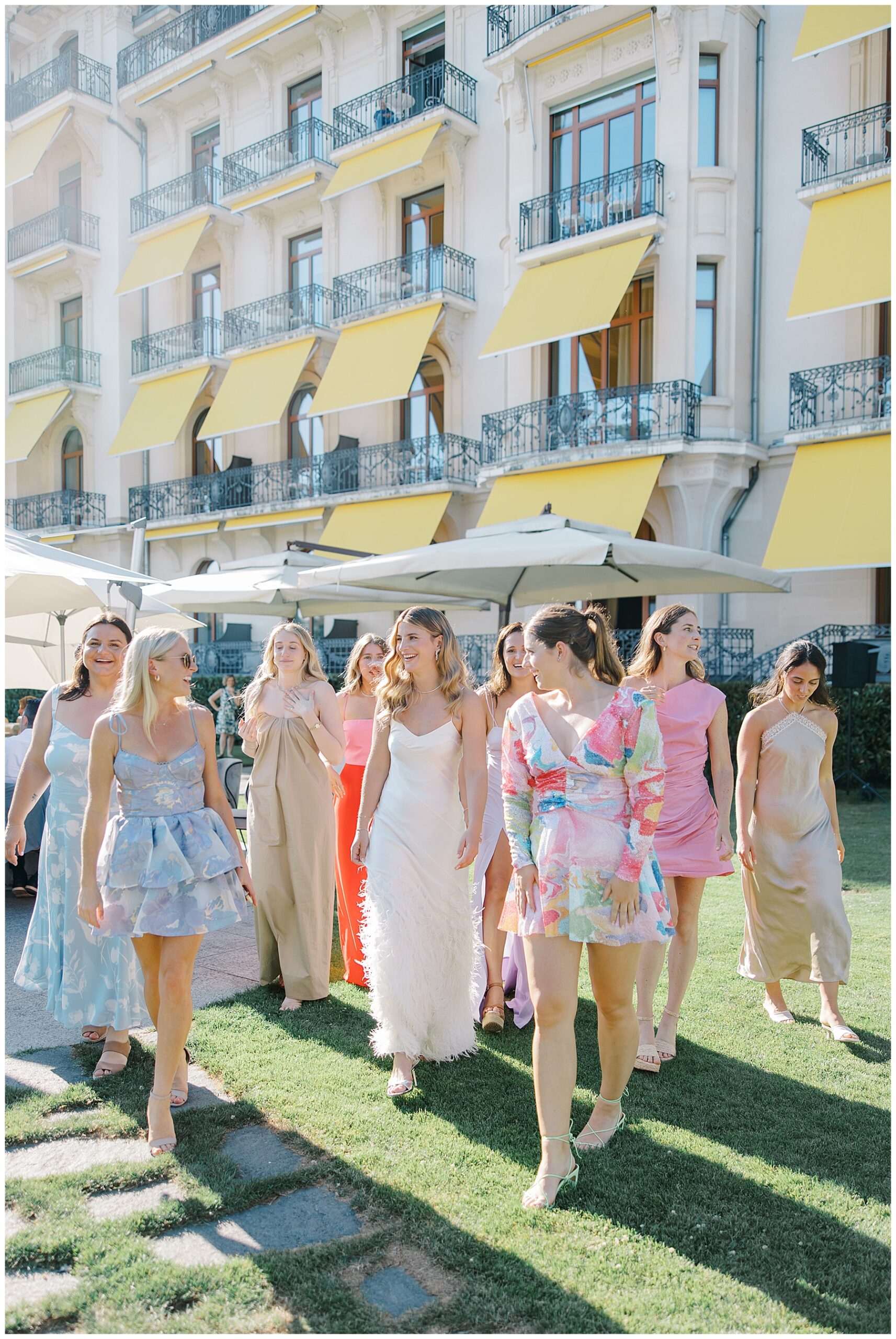 bride with bridesmaids in garden inspired dresses at rehearsal dinner 