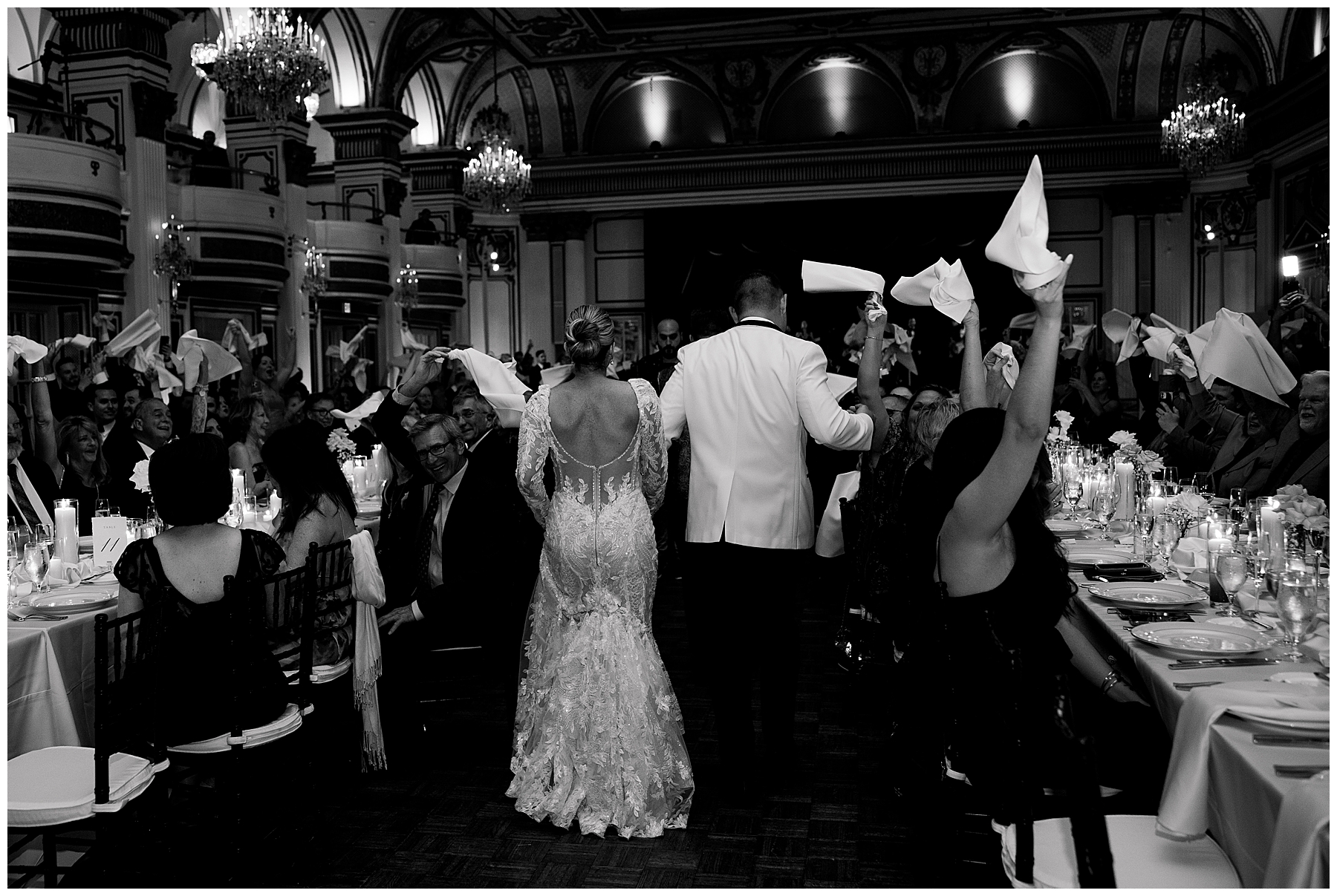 newlyweds enter reception with guests