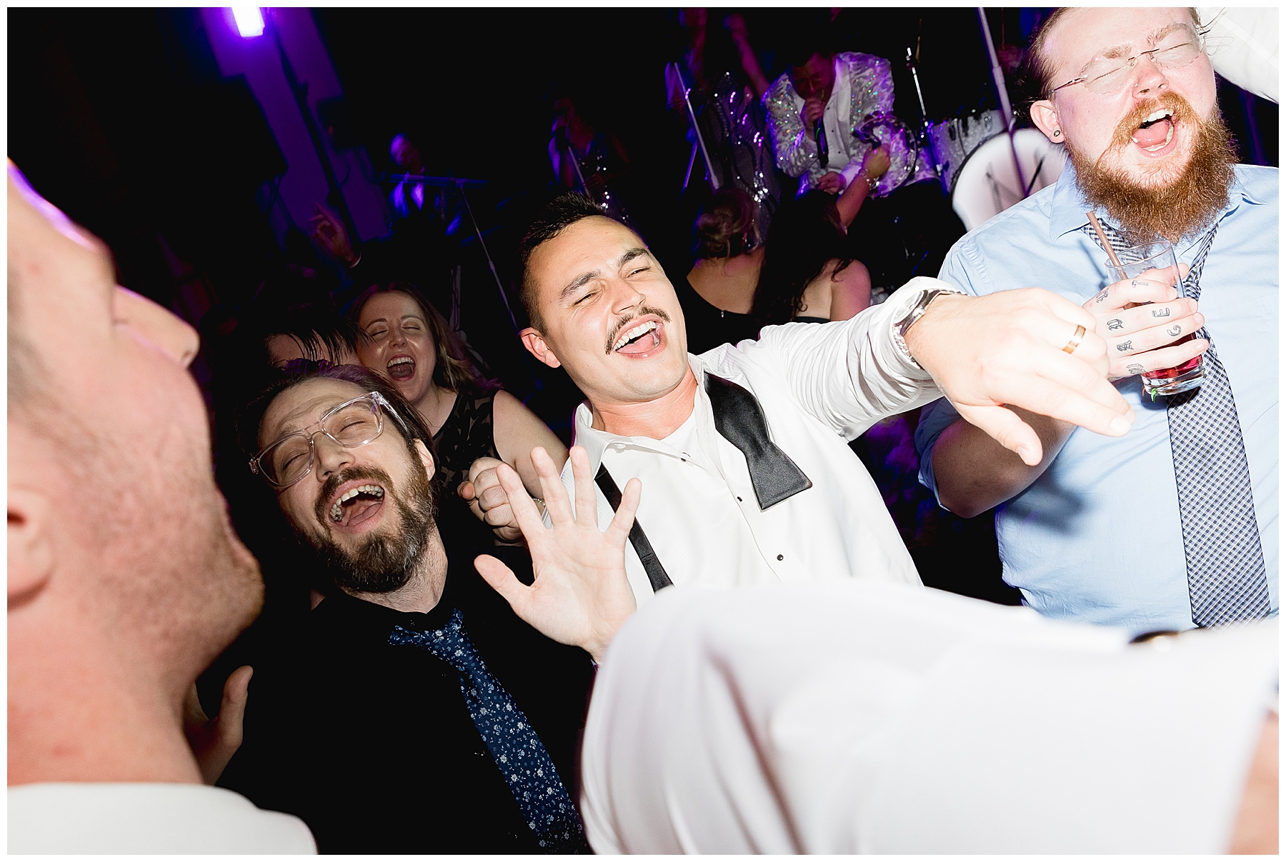 groom and guests on dance floor 