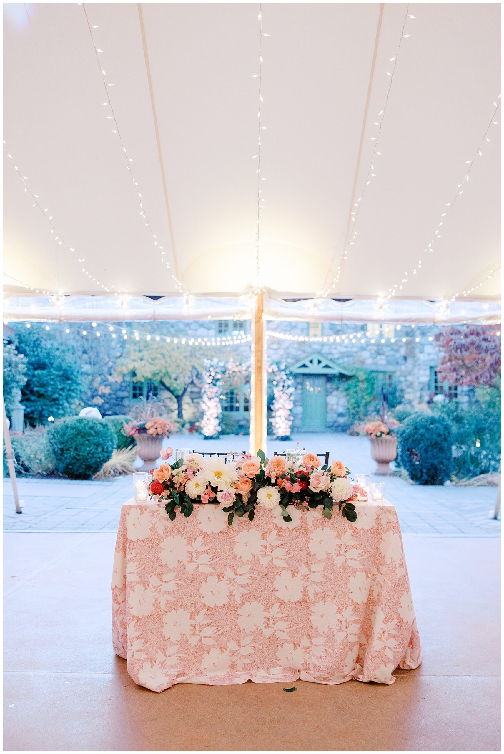 pink and white flower table cloth with soft florals decorating table