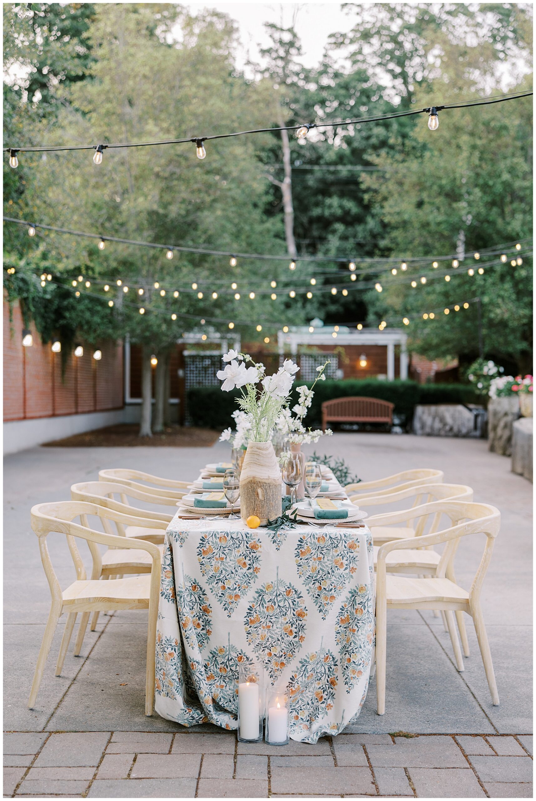 dinner and reception under stringed lights of patio at Intimate Misselwood Events Wedding on the North Shore